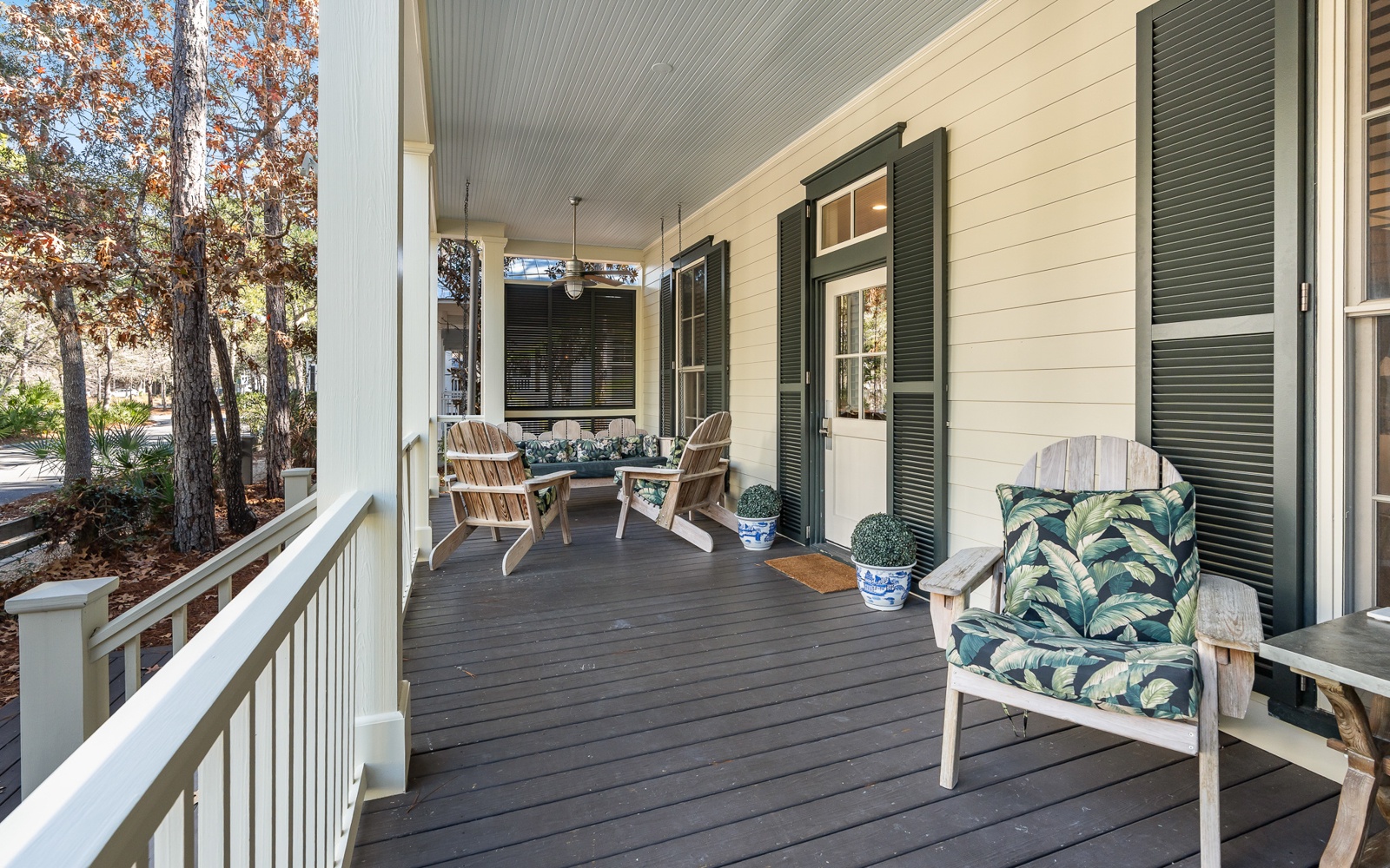 Your private covered porch welcomes you with comfortable seating and peaceful wooded views—perfect for morning coffee or evening relaxation.