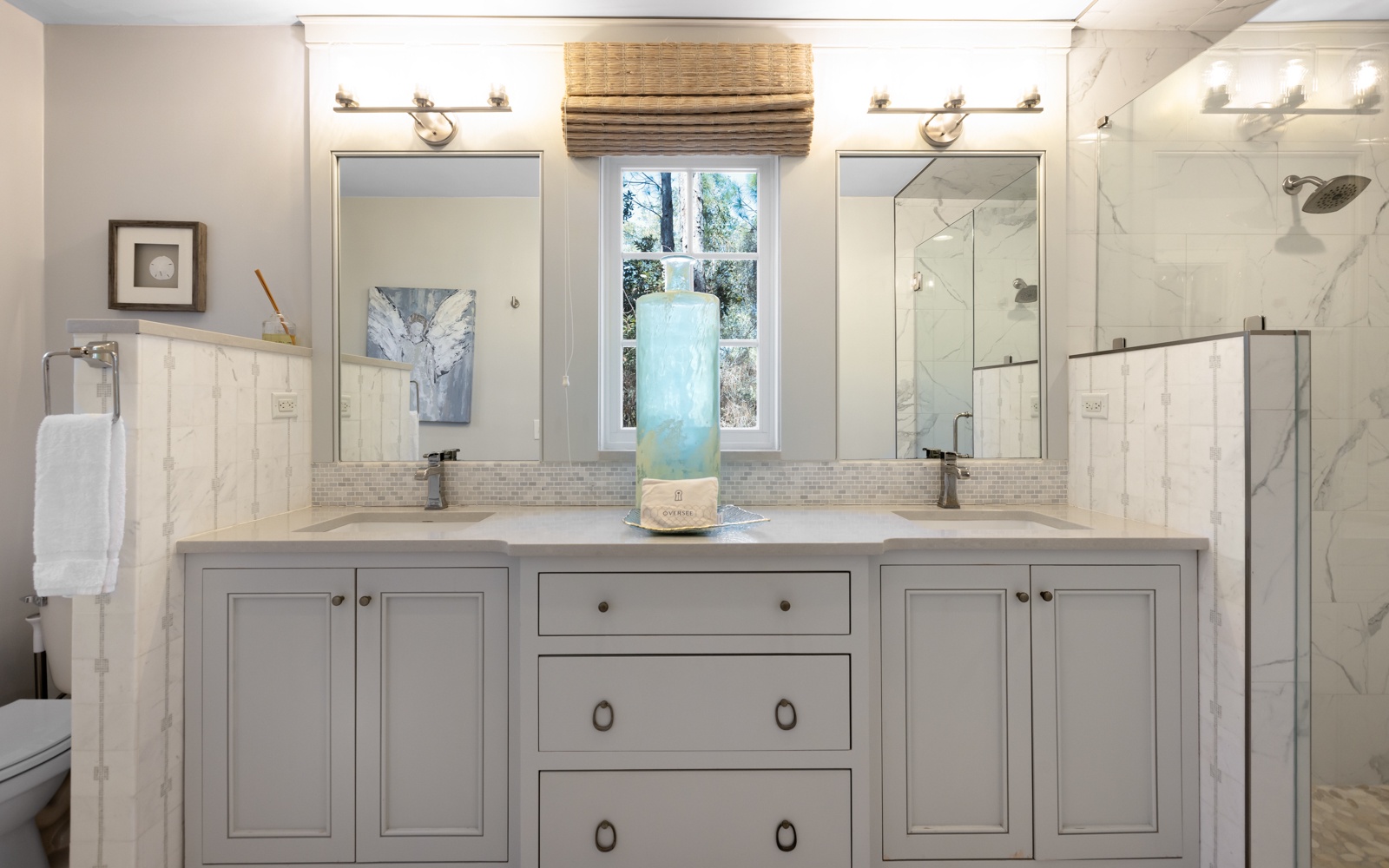 Refresh in your elegant marble bathroom with dual vanities, rainfall shower, and spa-like serenity.