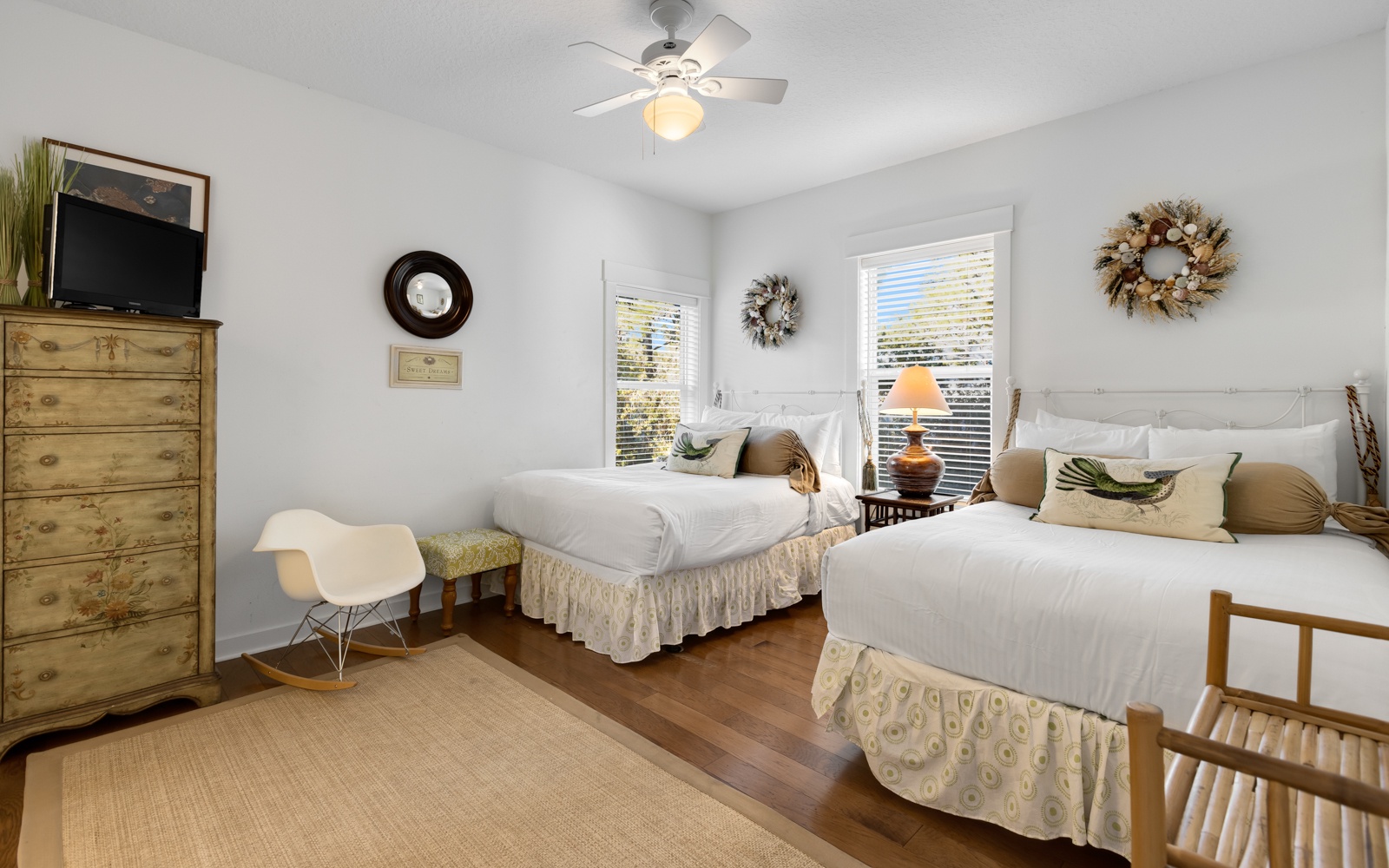 Rest peacefully in your bright twin bedroom with coastal charm, complete with ceiling fan and TV for comfort.