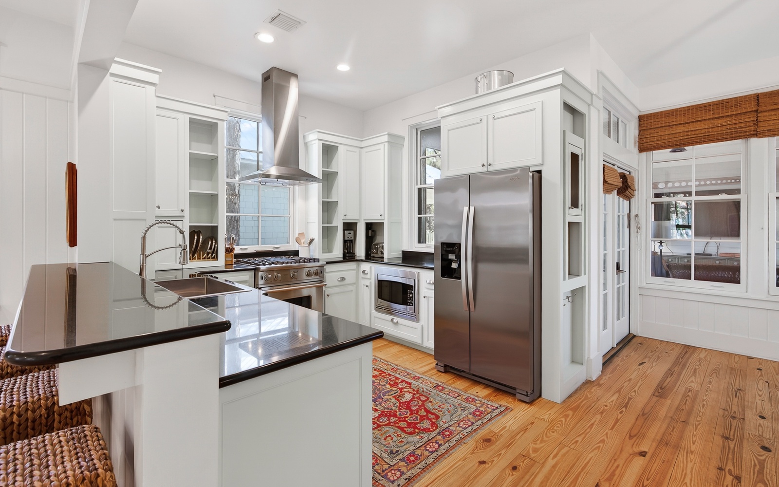 Cook memorable meals in your gourmet kitchen featuring gleaming granite counters, premium stainless steel appliances, and warm wood floors.