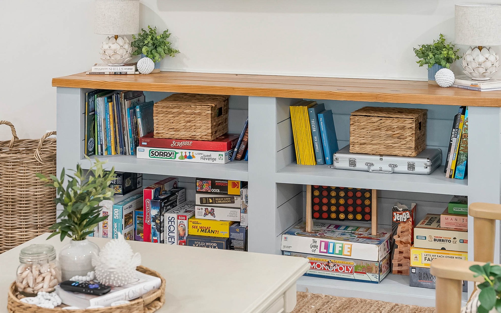 Your game room shelves are stocked with classics like Monopoly, Scrabble, and Life for cozy evenings of friendly competition.