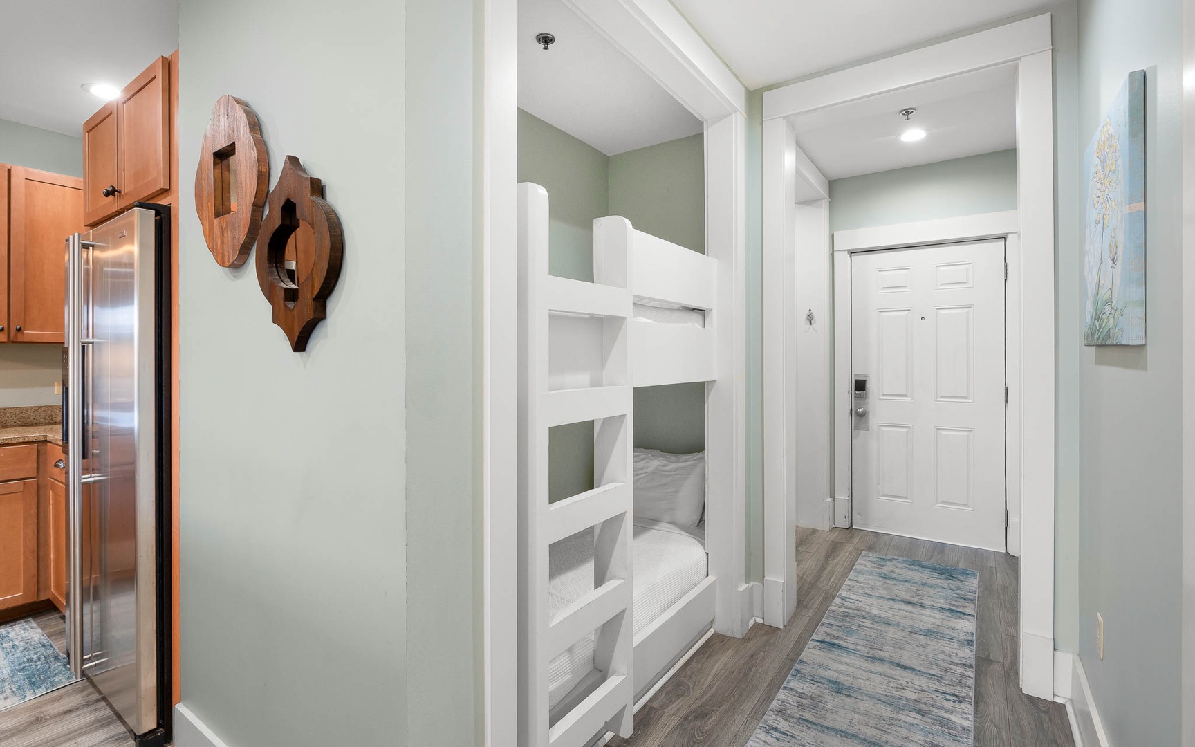 Your kids will love these stylish bunk beds tucked into this cozy nook, creating the perfect sleeping adventure.