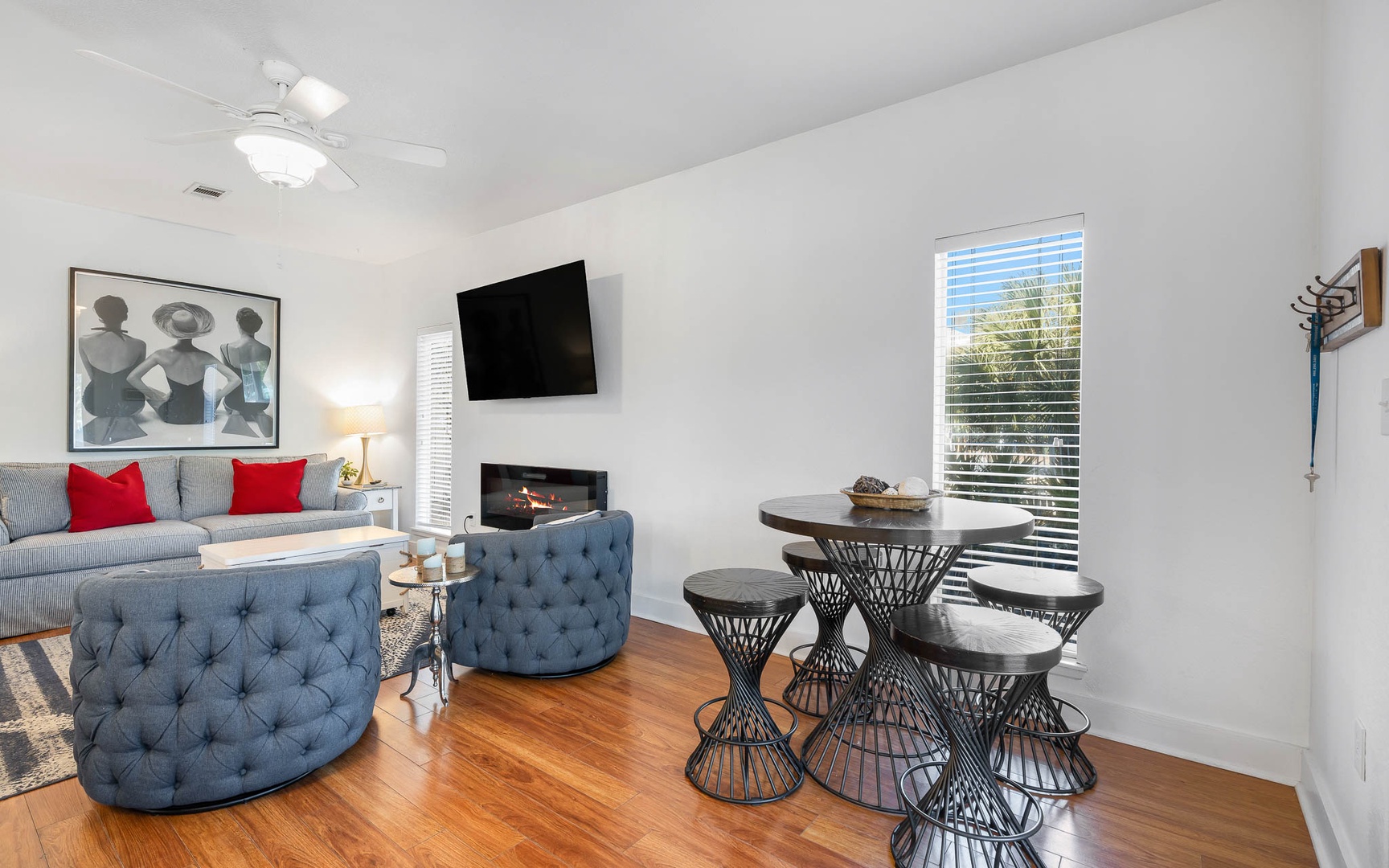 Relax in your stylish living space with cozy seating, modern fireplace, and intimate dining nook perfect for morning coffee or evening meals.