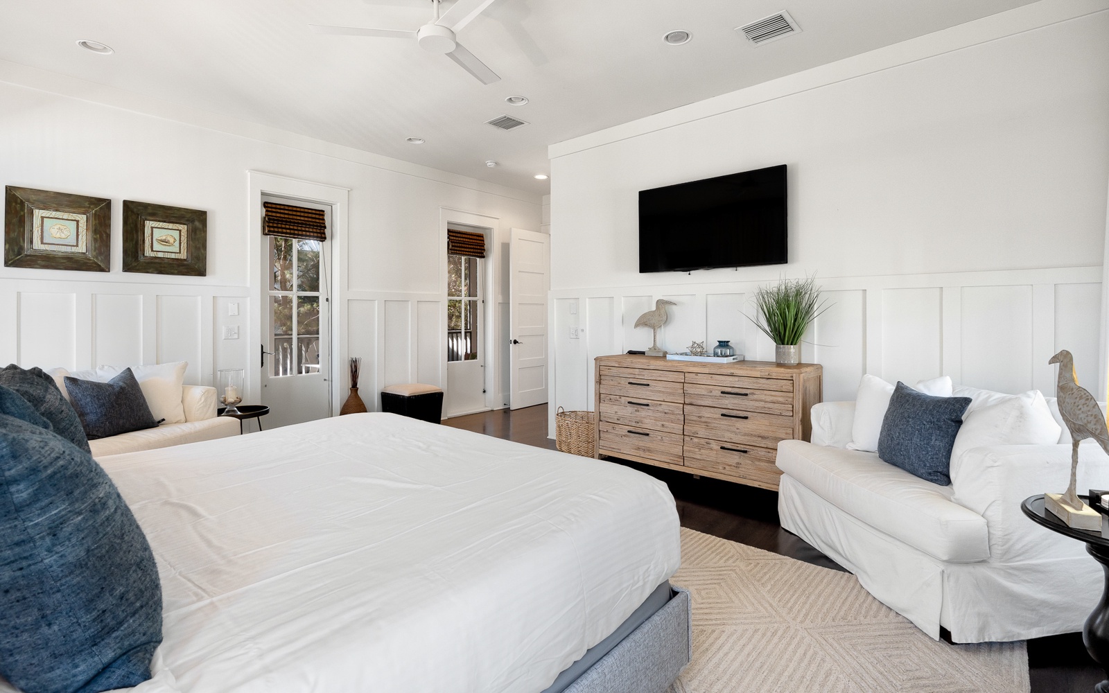 Unwind in your serene master suite with plush bedding, cozy seating, and modern amenities for the perfect night's rest.