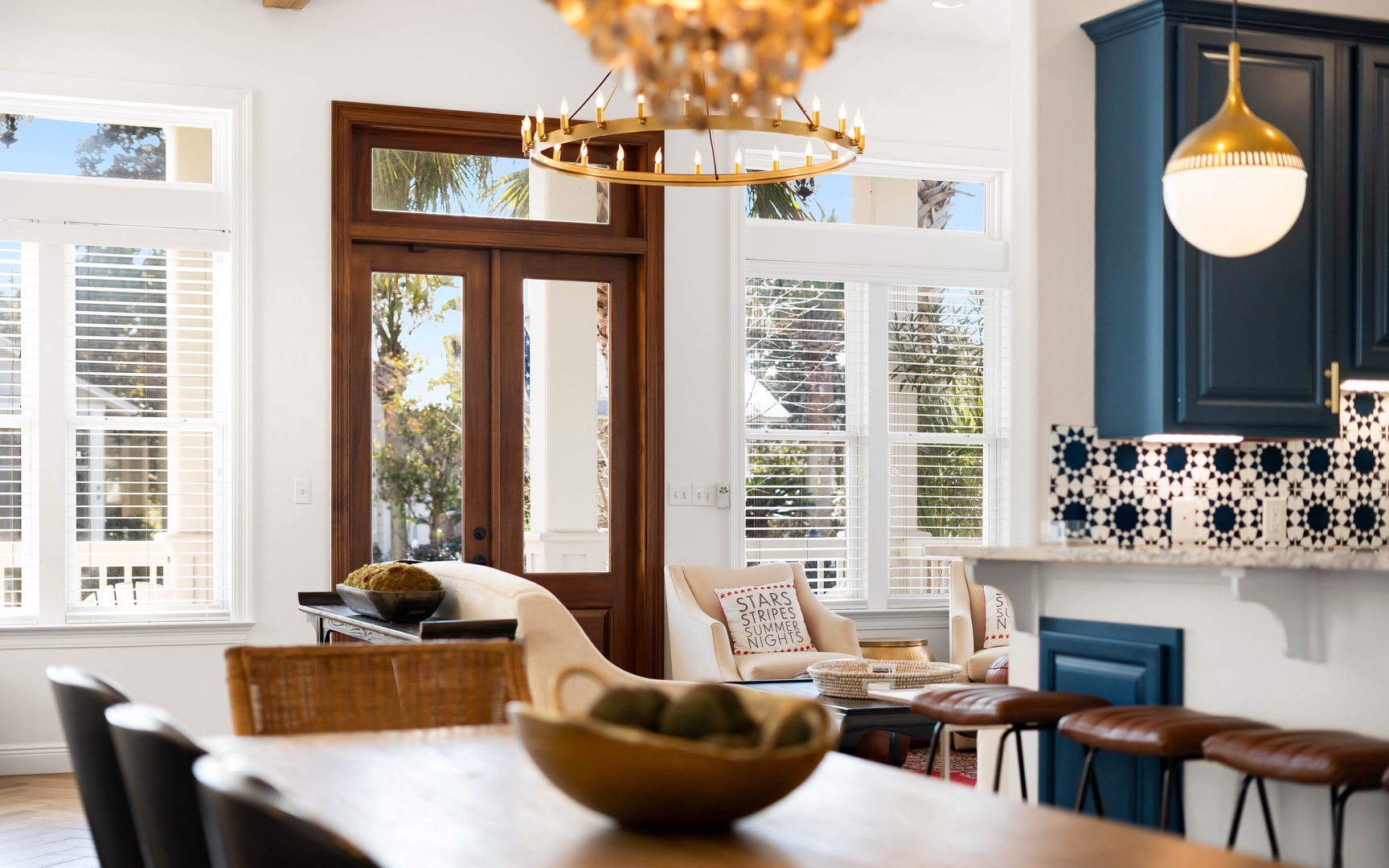 Your stylish kitchen flows seamlessly into the living area, where warm lighting and coastal views create the perfect space for cooking and relaxing together.