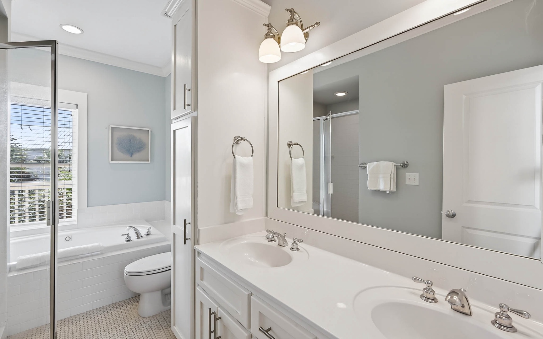 Unwind in your elegant ensuite with dual vanities, soaking tub, and fresh linens awaiting your arrival.