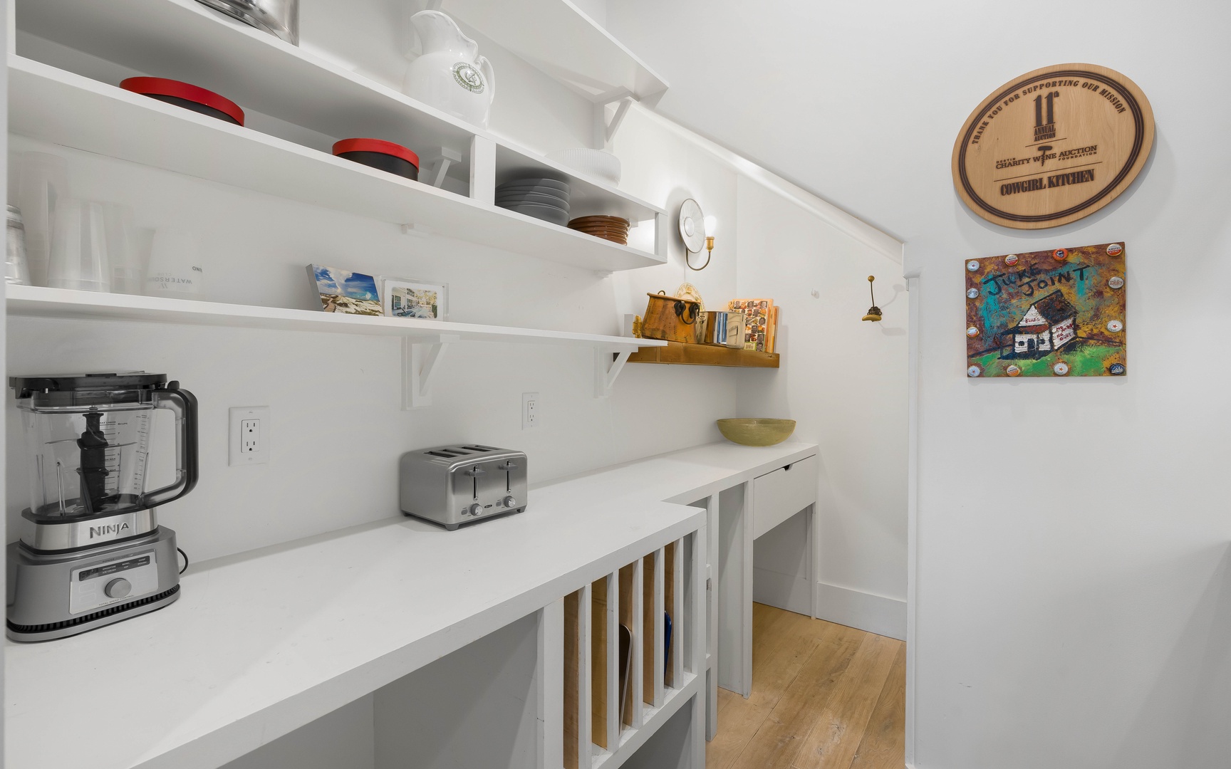 Your bright, organized pantry features everything you need—Ninja blender, toaster, and stylish storage for effortless meal prep.