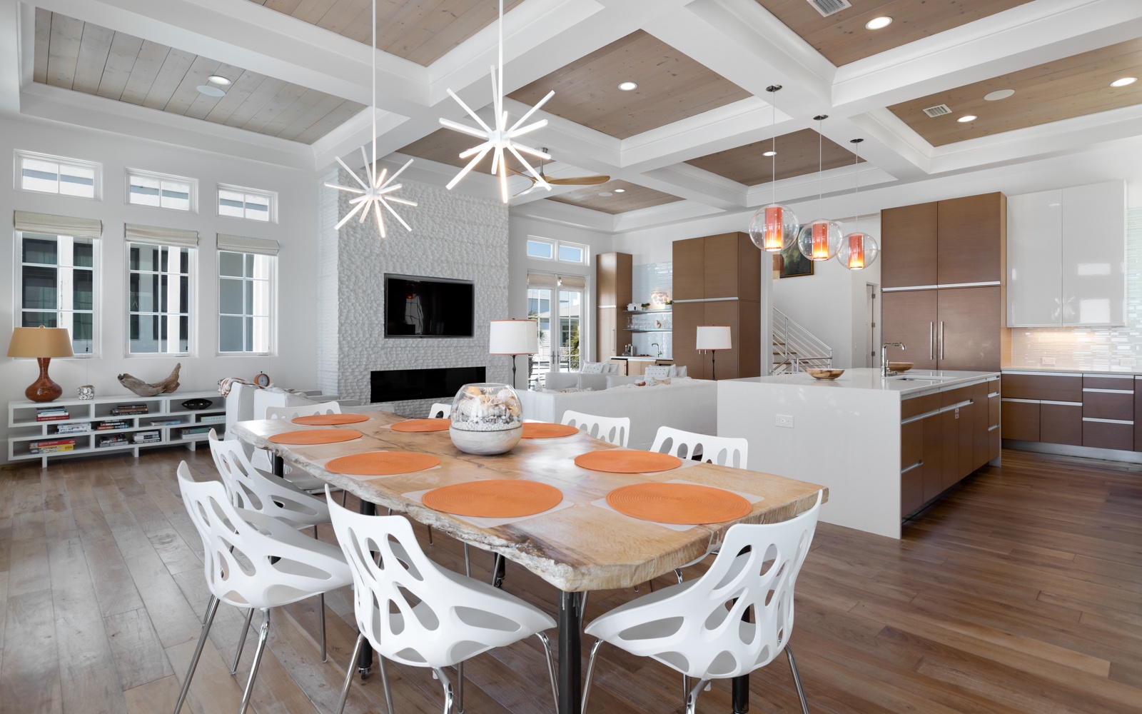 Your spacious open-plan living combines modern dining and kitchen with soaring coffered ceilings and designer lighting.