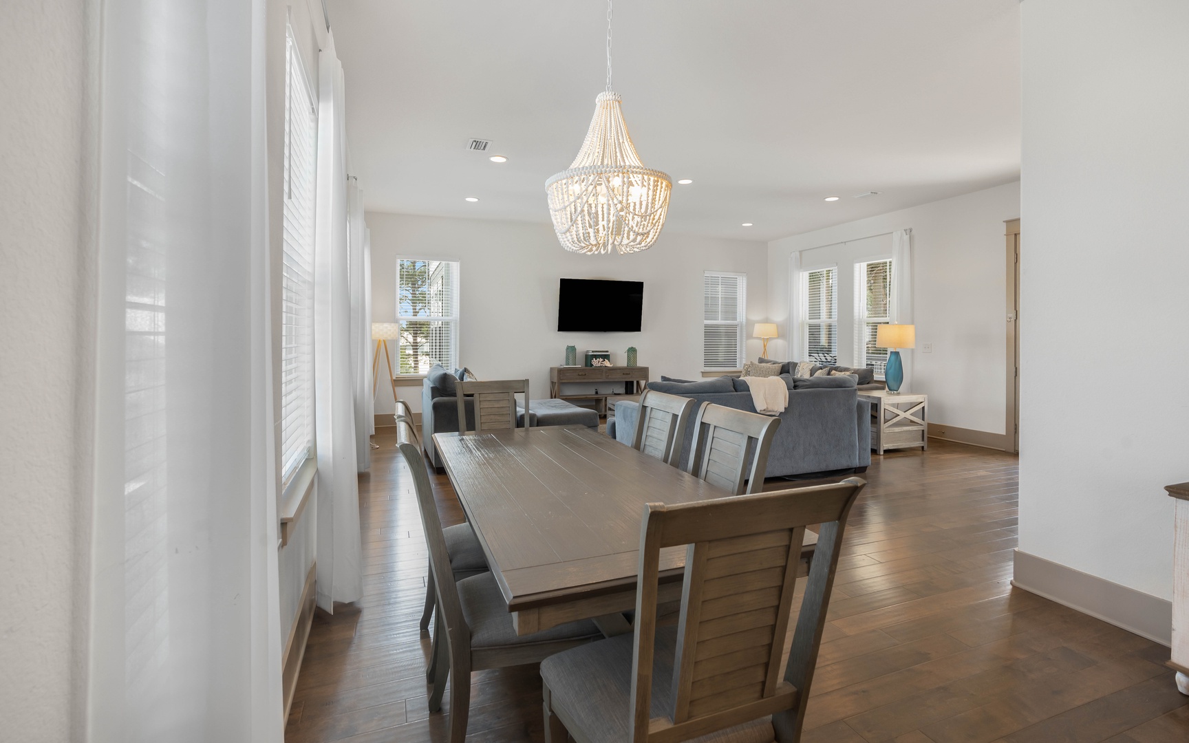 Gather around your spacious dining table beneath the stunning beaded chandelier, then unwind in the comfortable living area with flatscreen entertainment.
