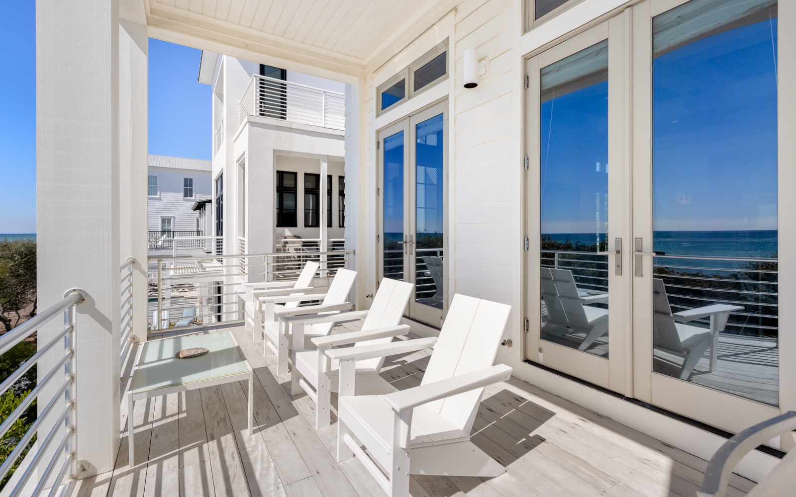 Unwind on your private balcony with gulf views, where white loungers invite you to soak up coastal breezes.