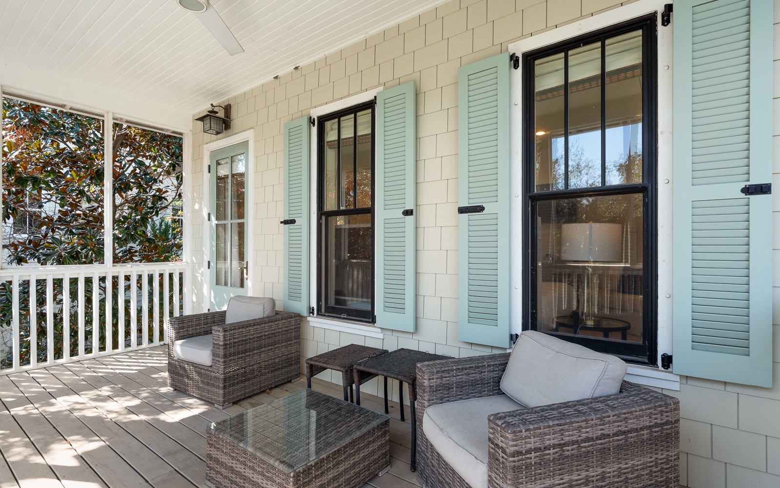 Your private covered porch offers comfortable wicker seating where you can unwind with morning coffee or evening drinks.