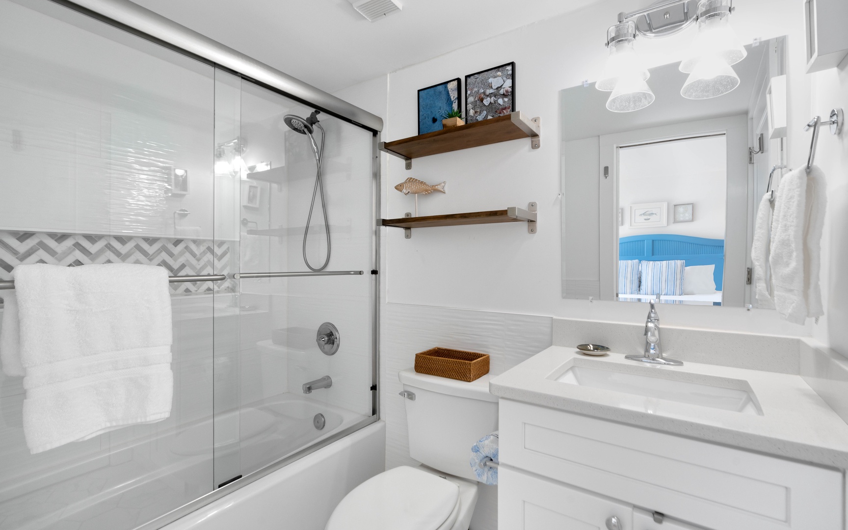 Unwind in your pristine bathroom featuring a luxurious soaking tub, refreshing walk-in shower, and thoughtful coastal touches that make every moment feel like a spa retreat.