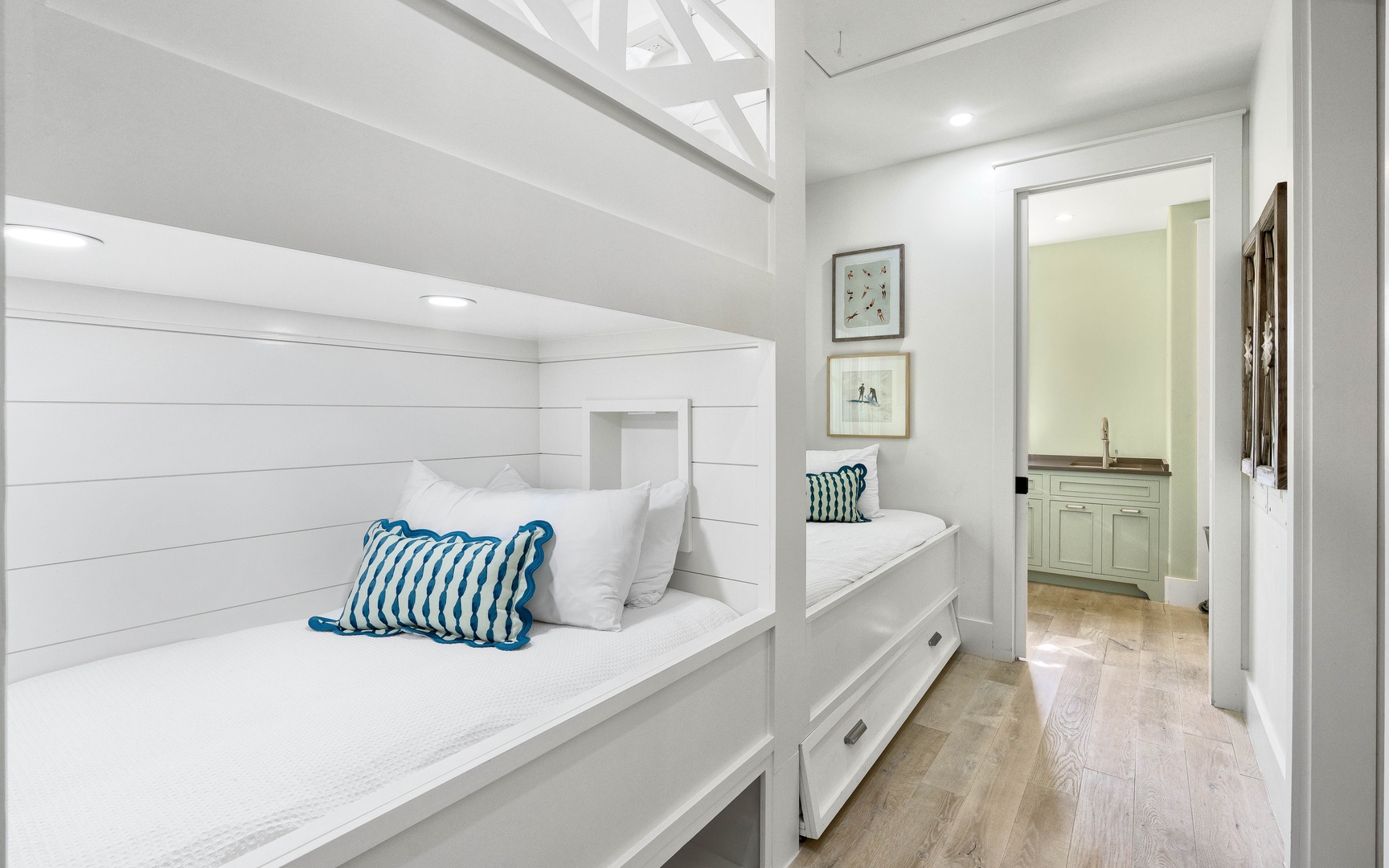 Unwind in your cozy built-in bunk nook with crisp linens and nautical touches—perfect for afternoon reading or peaceful rest.
