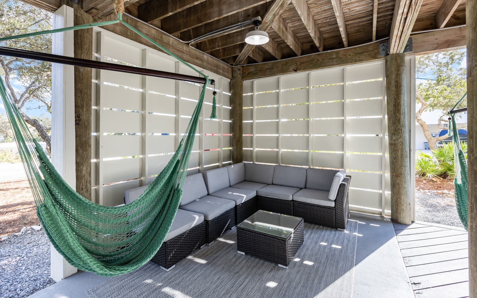 Unwind in your private outdoor lounge with comfy sectional seating and a dreamy hammock for afternoon naps.