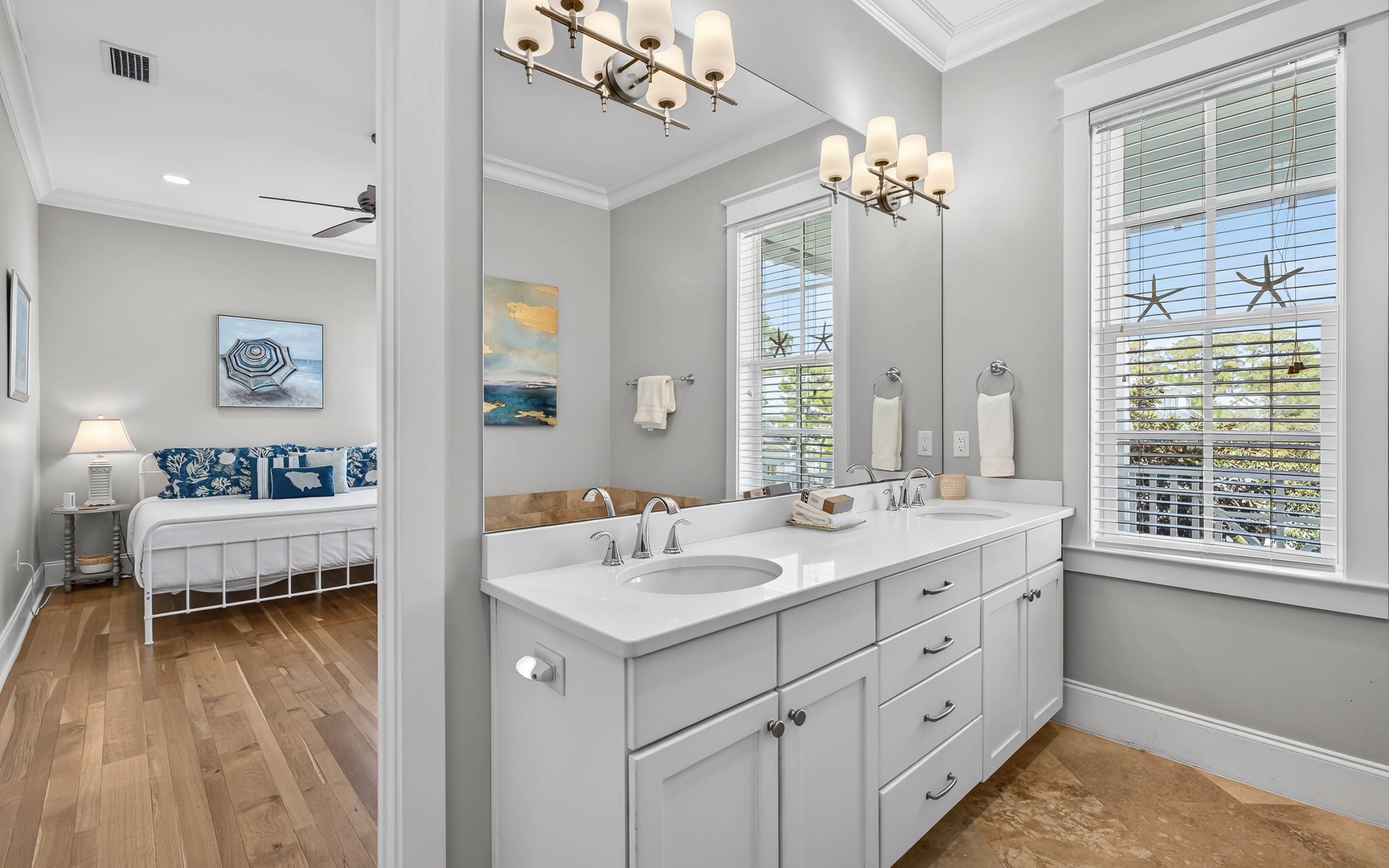 Pamper yourself in this elegant bathroom with dual vanities, perfect for getting ready together on your beach getaway.