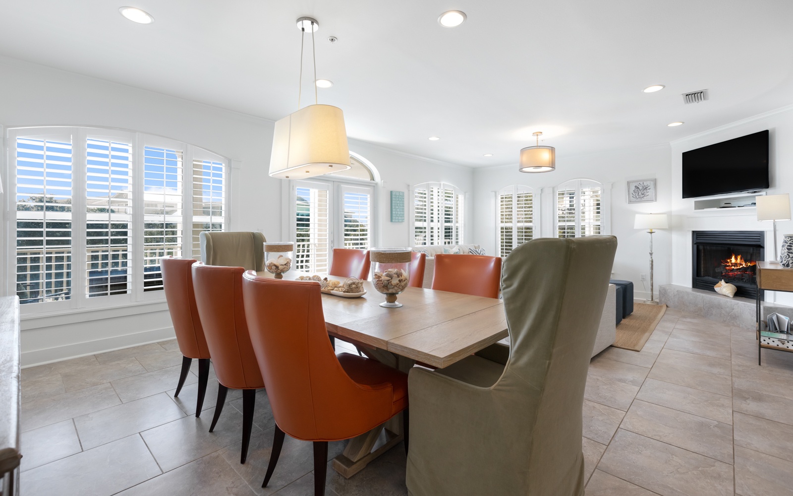 Gather around your stylish dining table where warm leather chairs invite memorable meals and conversation.