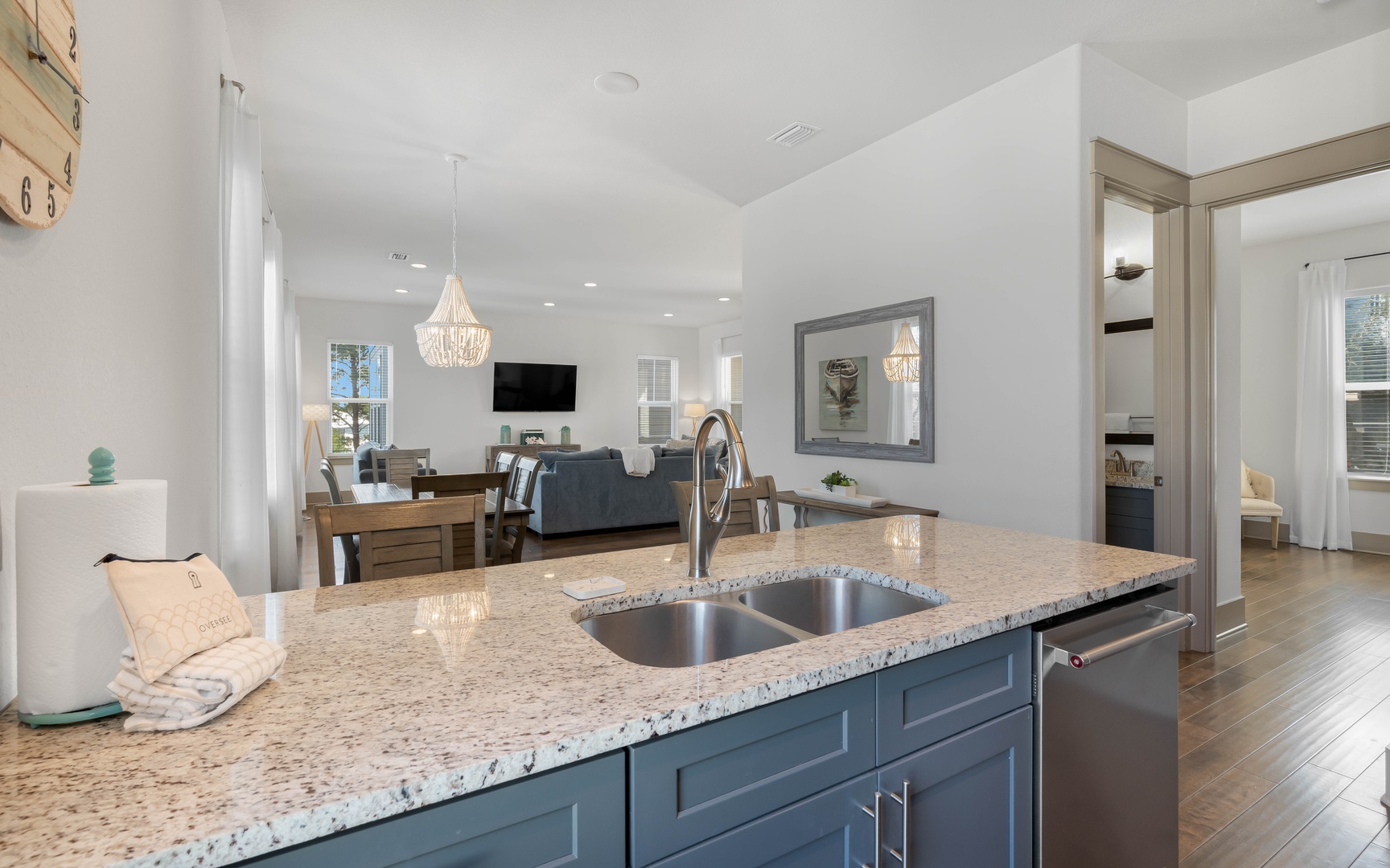 Your modern kitchen island flows seamlessly into the elegant living area, creating the perfect space for cooking and entertaining.