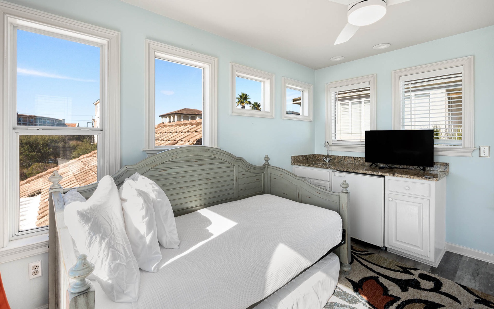Drift off in your serene bedroom, where soft light pours through windows and coastal breezes refresh your dreams.