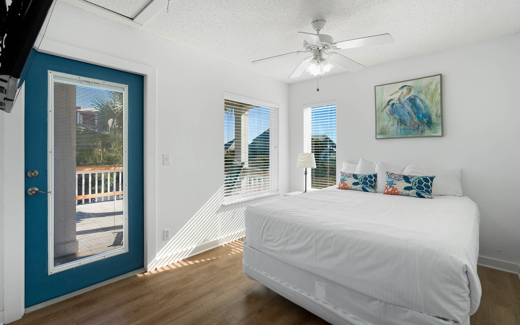 Drift off to sleep in your bright bedroom with coastal artwork and access to your private balcony.