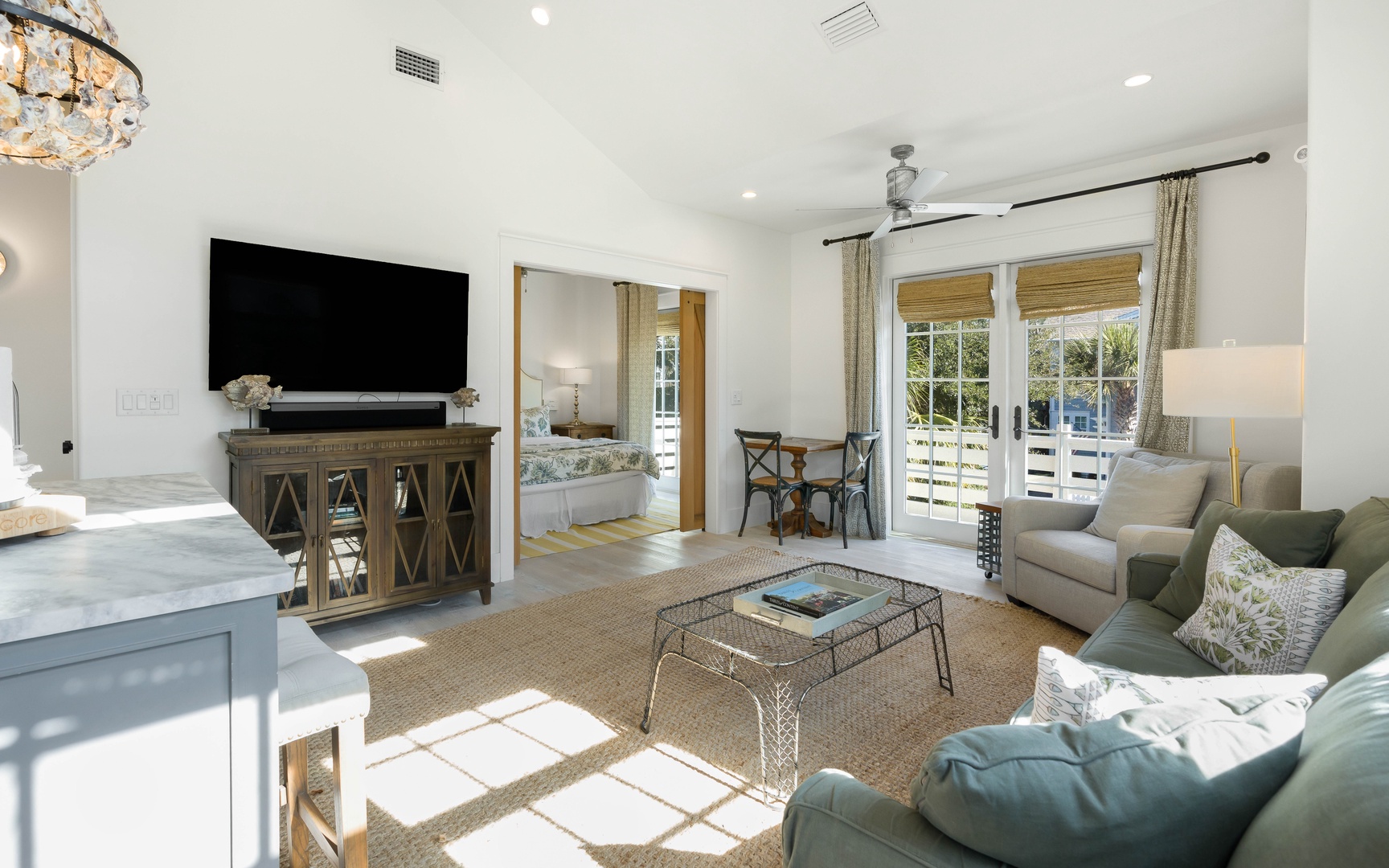 Unwind in your elegant living space where coastal comfort meets modern luxury, complete with entertainment center and peaceful balcony views.