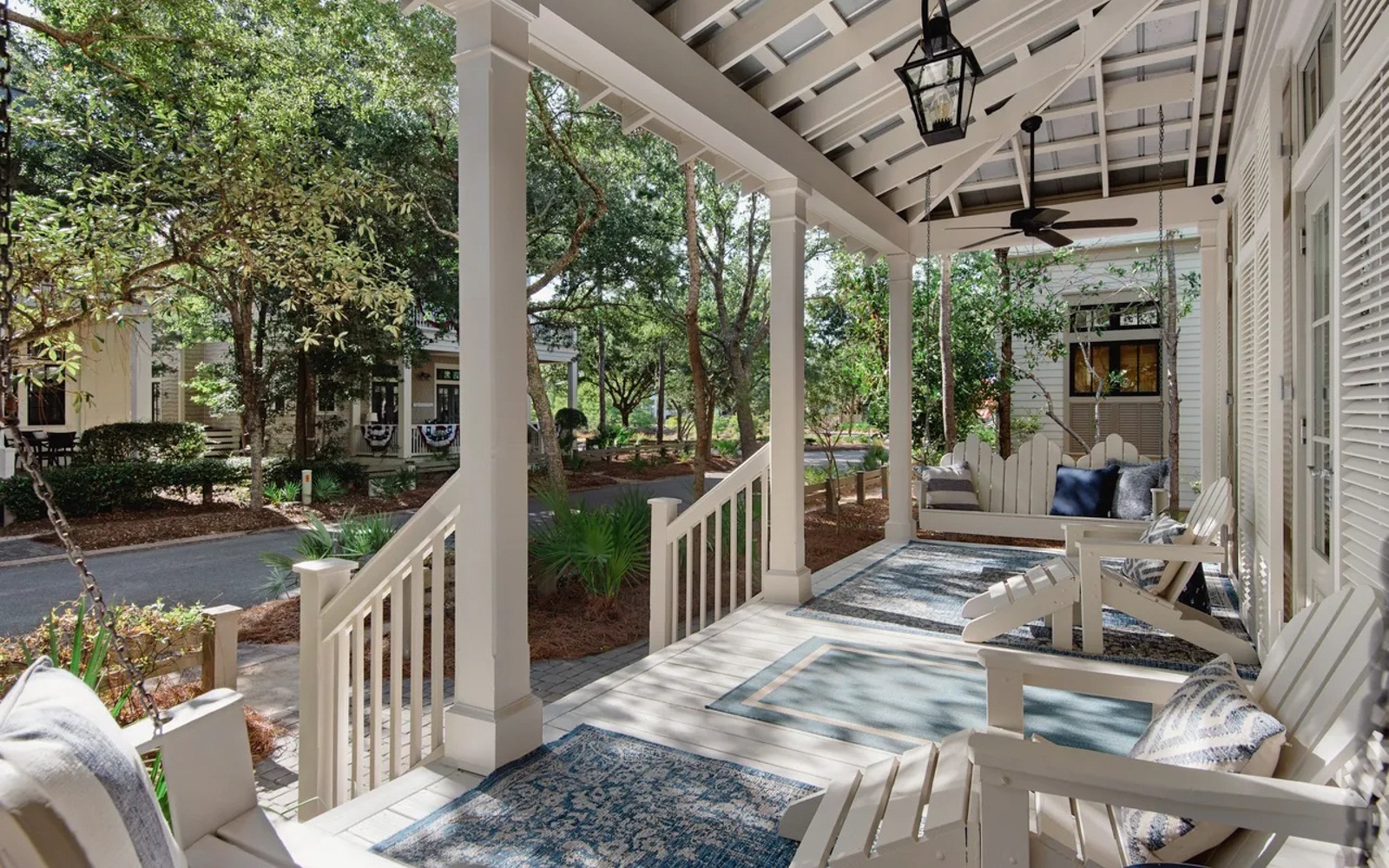 Relax on your charming covered porch with comfortable seating, ceiling fans, and peaceful garden views—your perfect spot for morning coffee or evening unwinding.