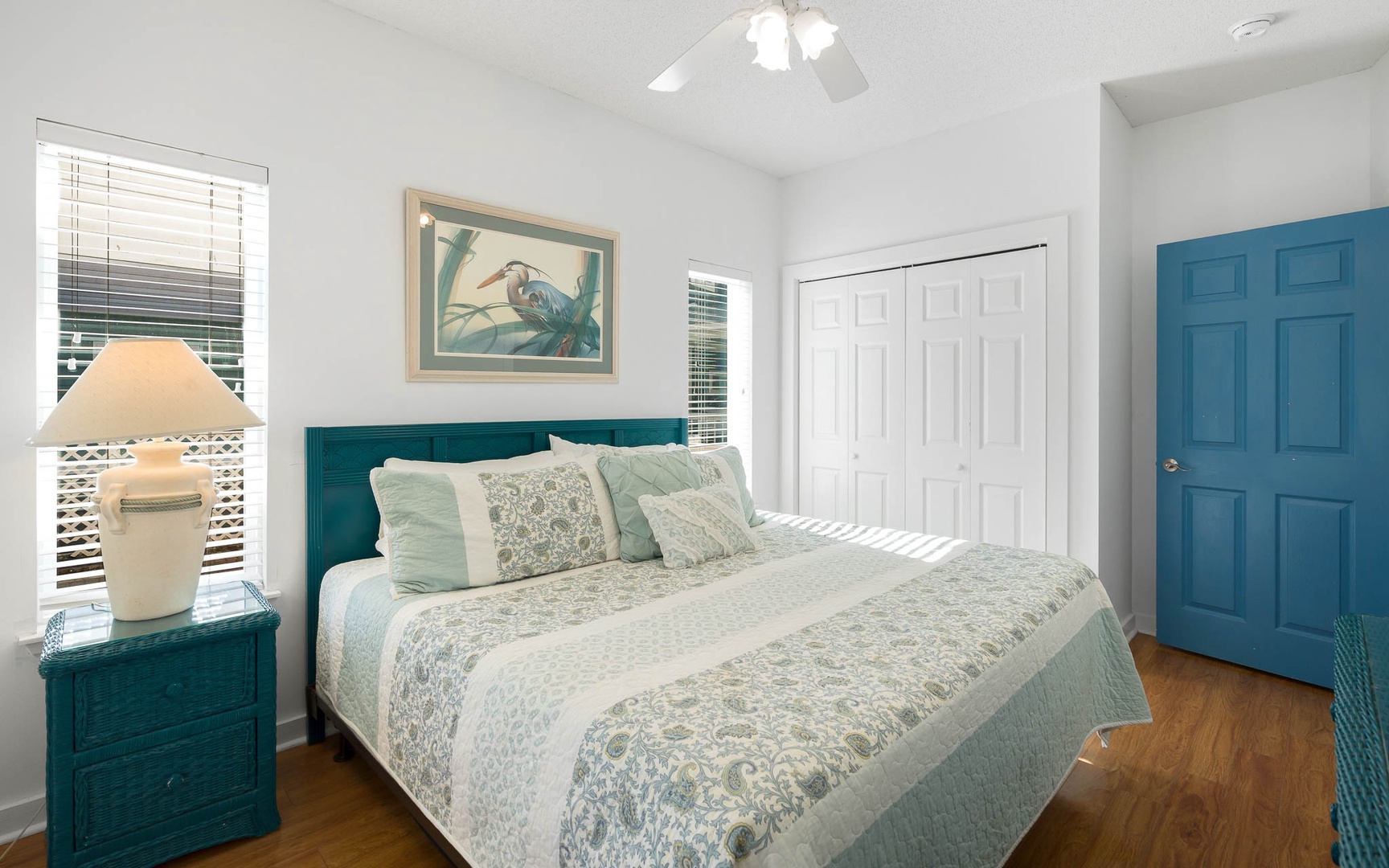 Drift into peaceful sleep in your coastal-themed bedroom, where calming teal tones and soft linens create the perfect sanctuary for rest.