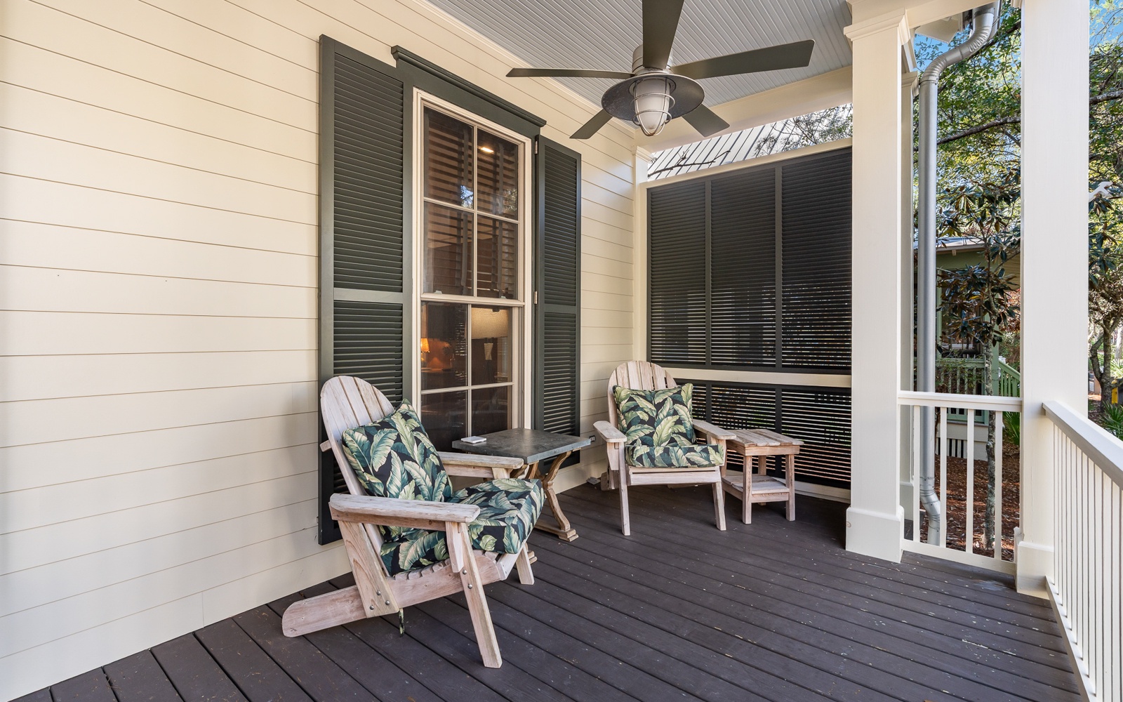 Unwind on your private screened porch with comfortable seating and tropical cushions, where ceiling fans keep you cool while you sip morning coffee.