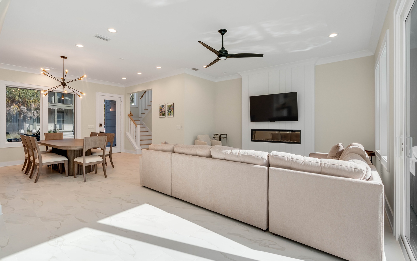 Sink into plush seating while enjoying your favorite shows on the wall-mounted TV, with elegant dining space perfect for memorable meals together.