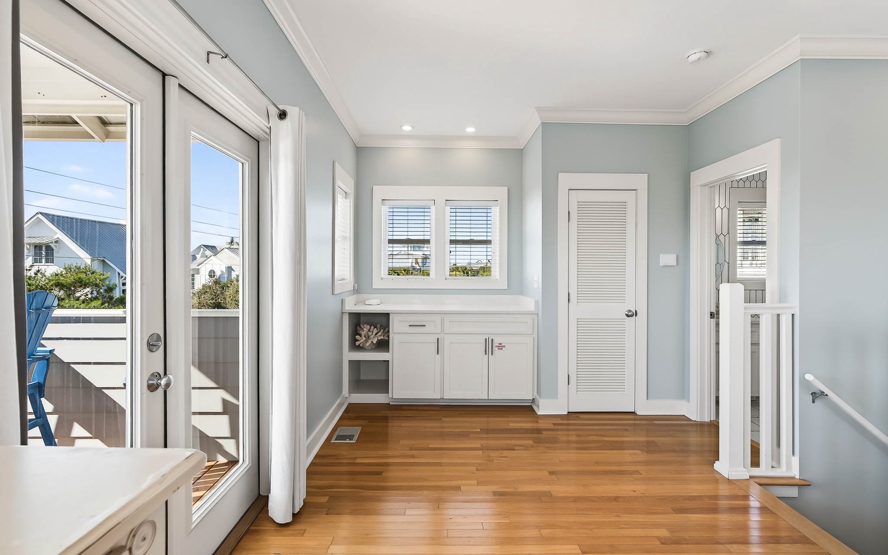 Step into your bright, airy space with warm hardwood floors and calming coastal colors that instantly put you at ease.