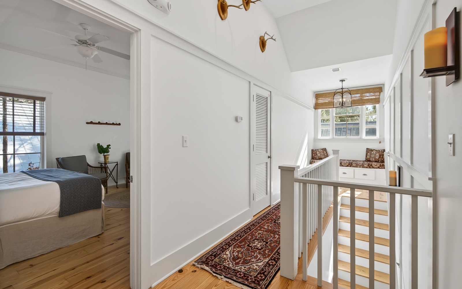 Bright upstairs hallway connects your cozy bedroom to a charming window nook - perfect for morning coffee or quiet moments.