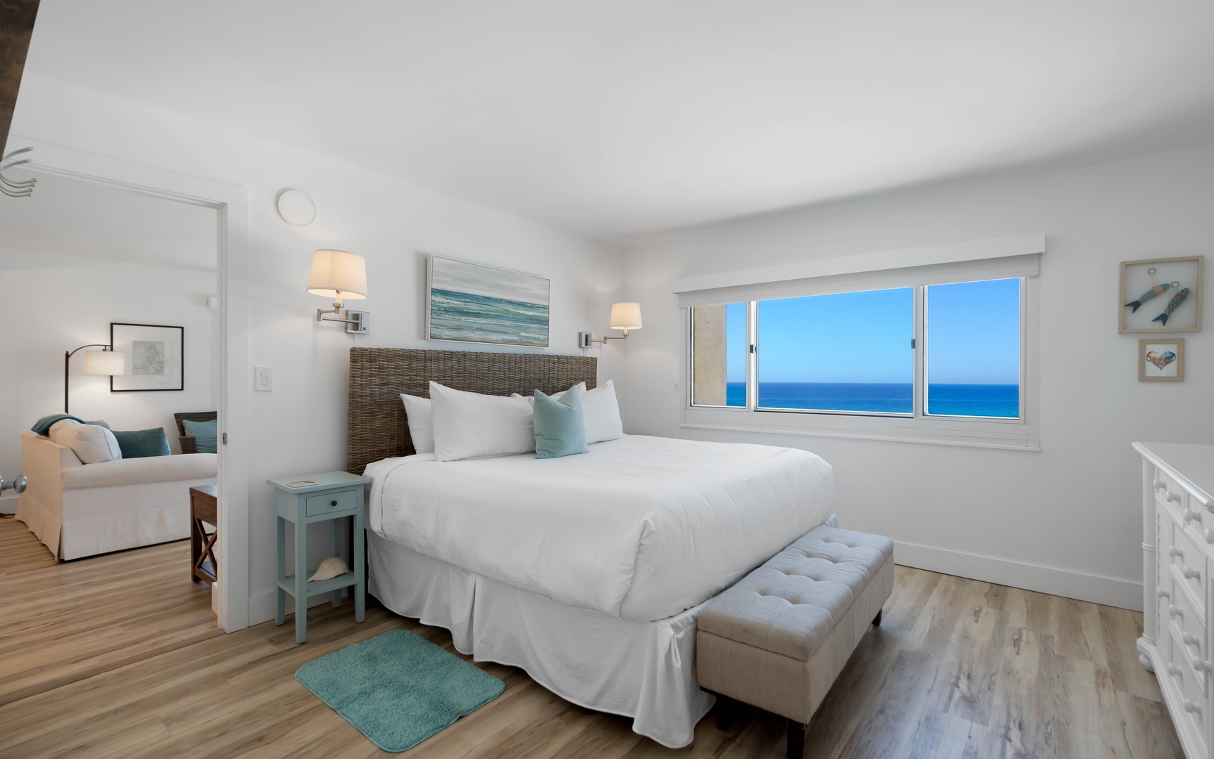 Wake up to endless ocean views from your serene bedroom sanctuary, where soft coastal hues and crisp linens create the perfect retreat.