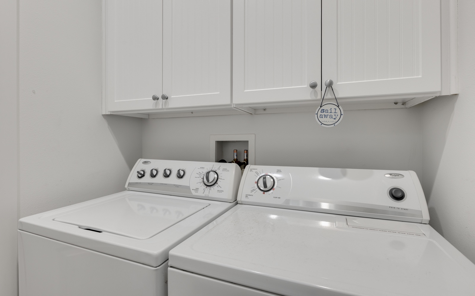 Your own laundry room keeps your clothes fresh throughout your stay, with convenient storage above for supplies.