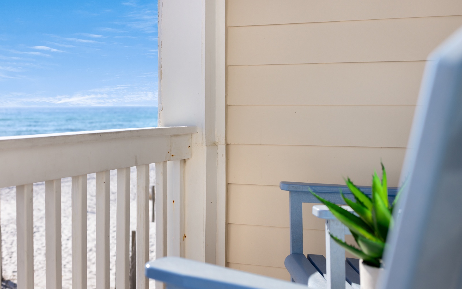Your private balcony overlooking endless ocean waves creates the perfect spot for morning coffee and peaceful moments.