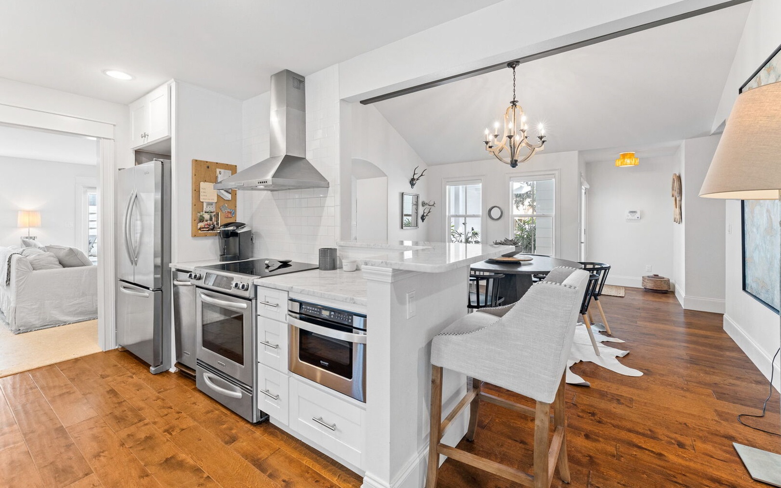 Step into your open-concept haven where the modern kitchen flows seamlessly into cozy living spaces, perfect for memorable meals together.