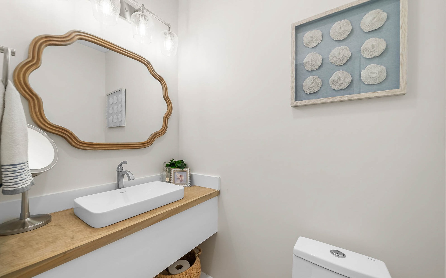 Your private bathroom features a stylish floating vanity with vessel sink and thoughtful coastal touches that create a serene, spa-like retreat.