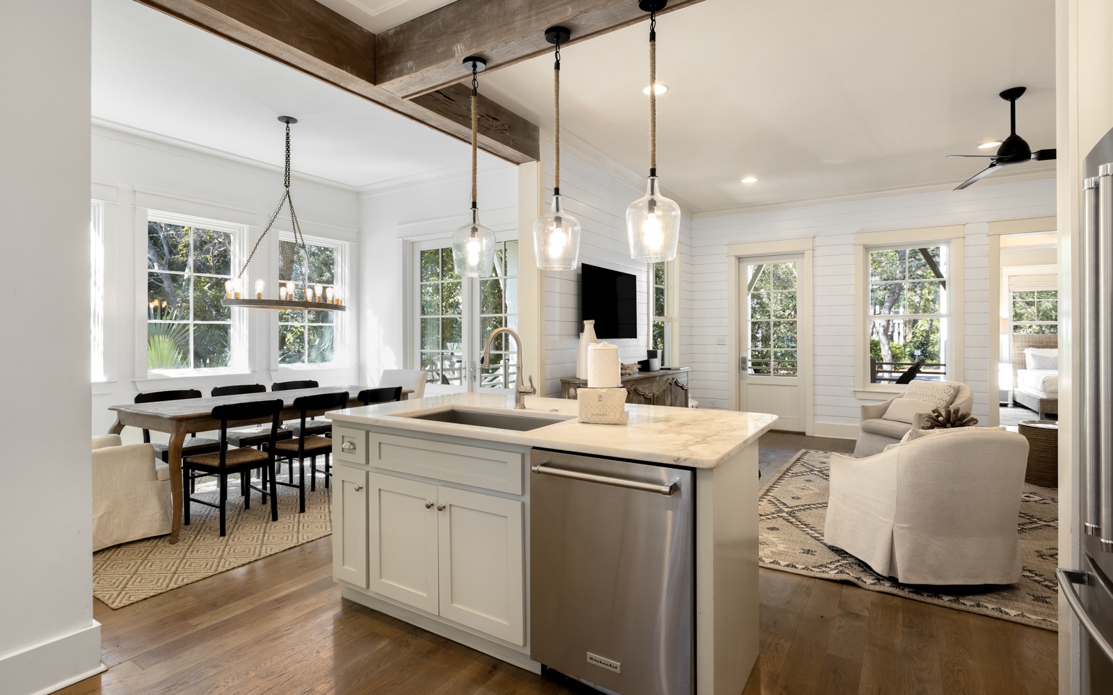 Your open-concept living space seamlessly blends modern comfort with rustic charm, featuring gleaming hardwood floors and soaring ceilings.