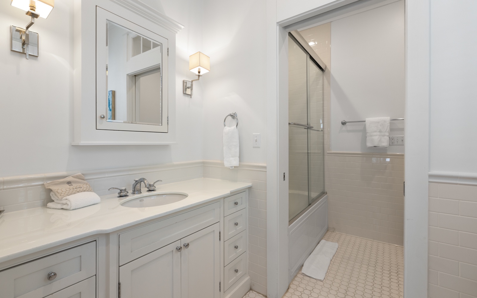 Step into your spa-like ensuite where marble countertops and soft lighting create a serene sanctuary for your morning routine.