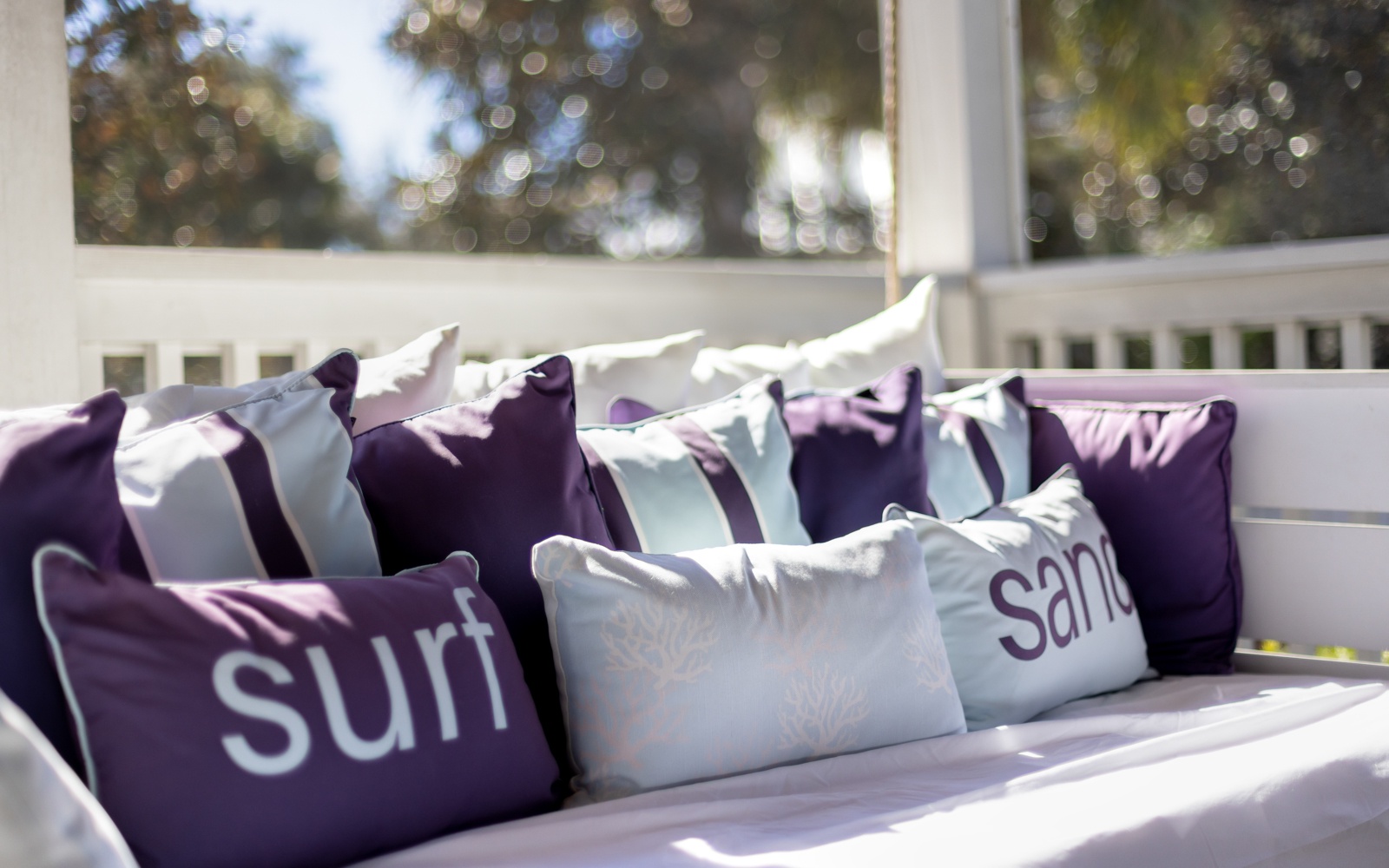 Sink into plush cushions on your private balcony, where 'surf' and 'sand' pillows invite lazy afternoons in the sun.