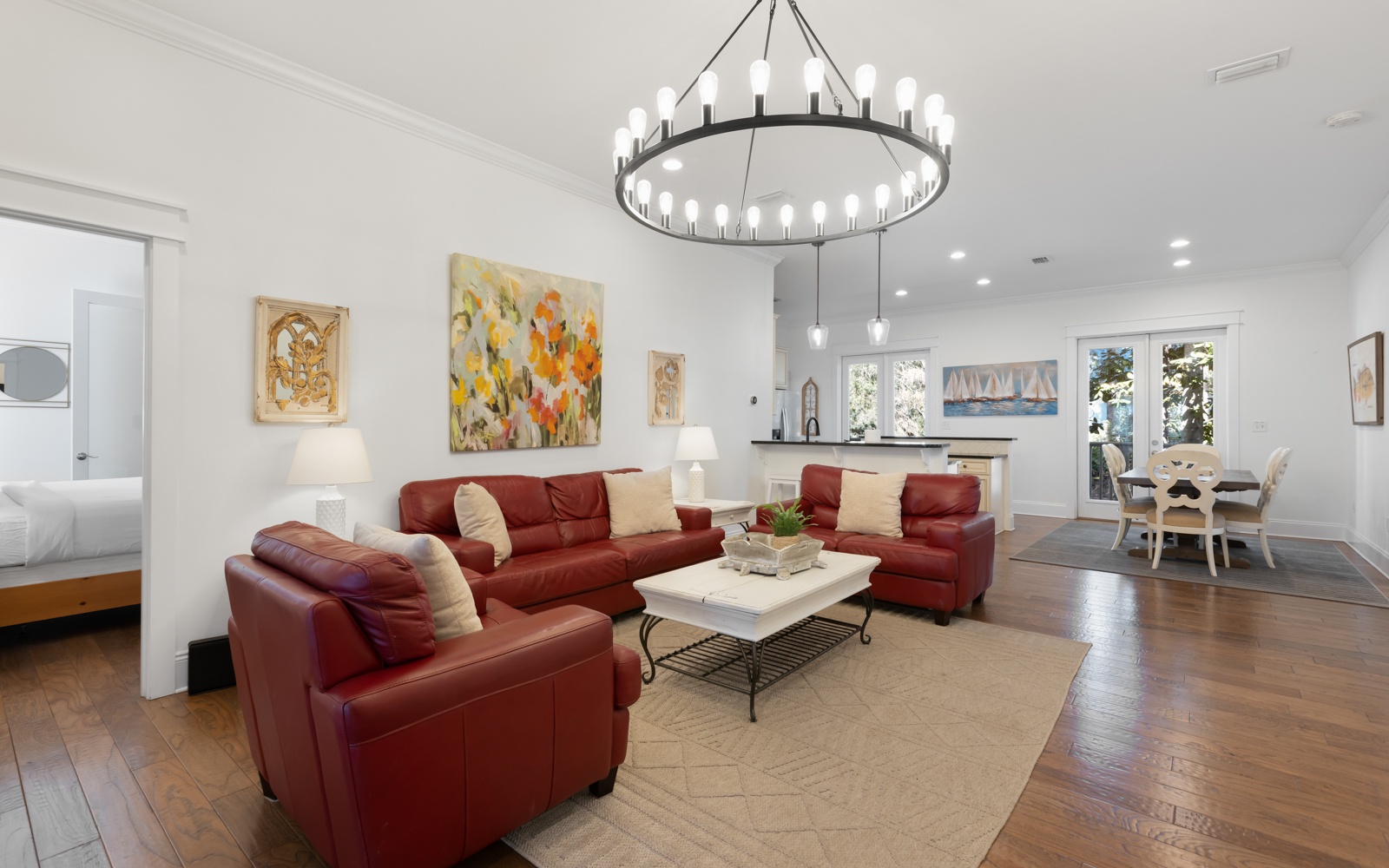 Relax in your spacious open-concept living area with rich leather seating and stunning chandelier, creating the perfect space for memorable gatherings.