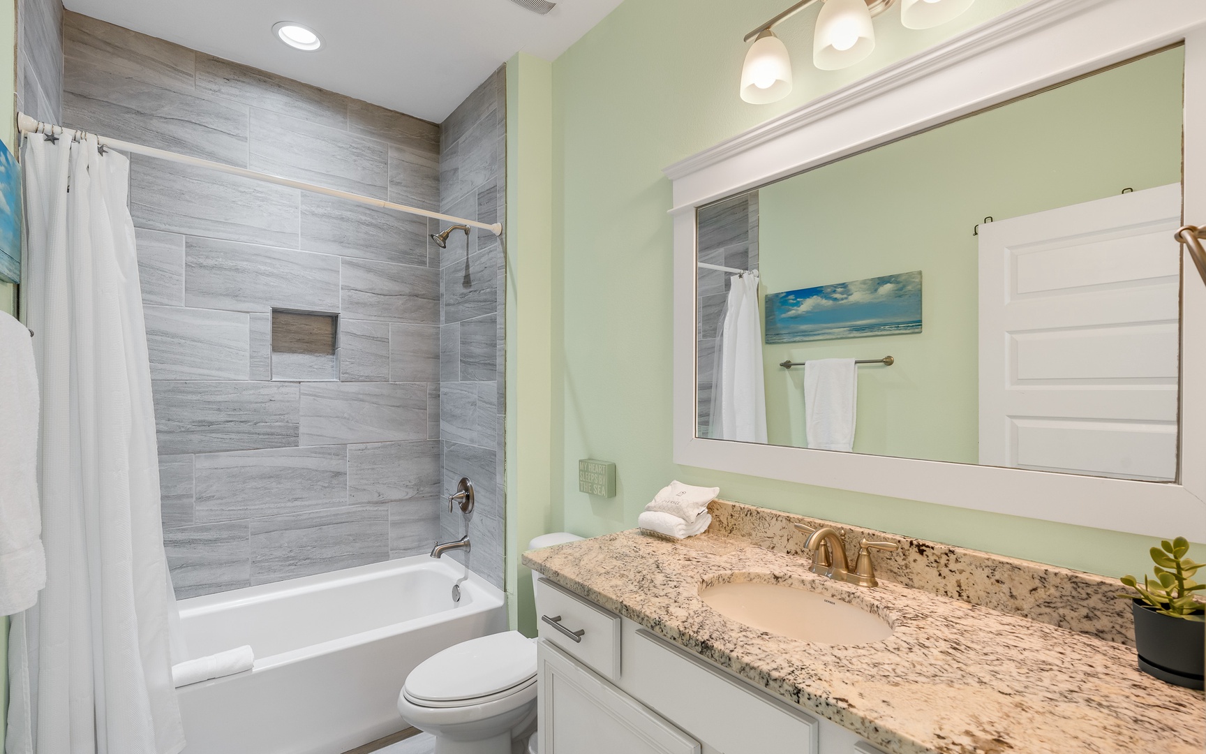 Unwind in your elegant bathroom with granite counters, modern tile work, and a soaking tub perfect for relaxing after your adventures.