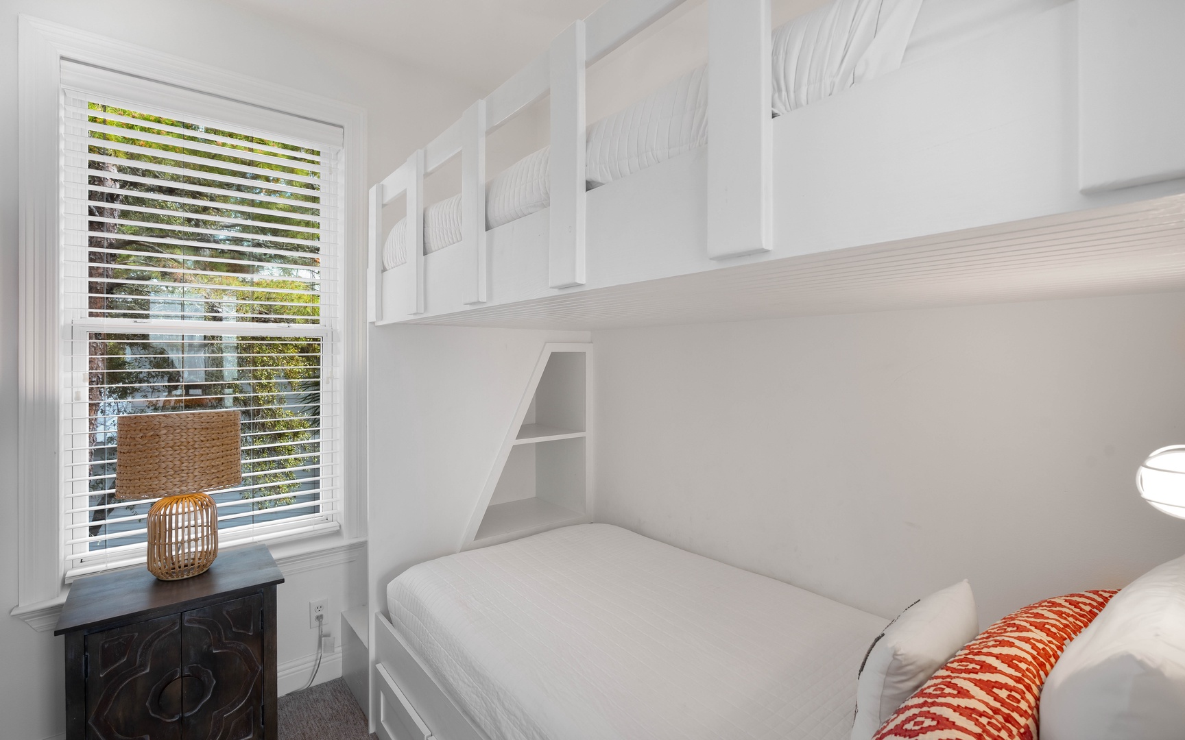 Your cozy bunk room features custom built-in beds with crisp linens and smart storage, perfect for families or groups traveling together.