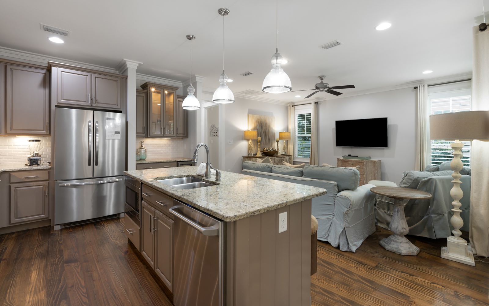 Your open-concept kitchen and living space seamlessly blends modern comfort with elegant design for memorable gatherings.