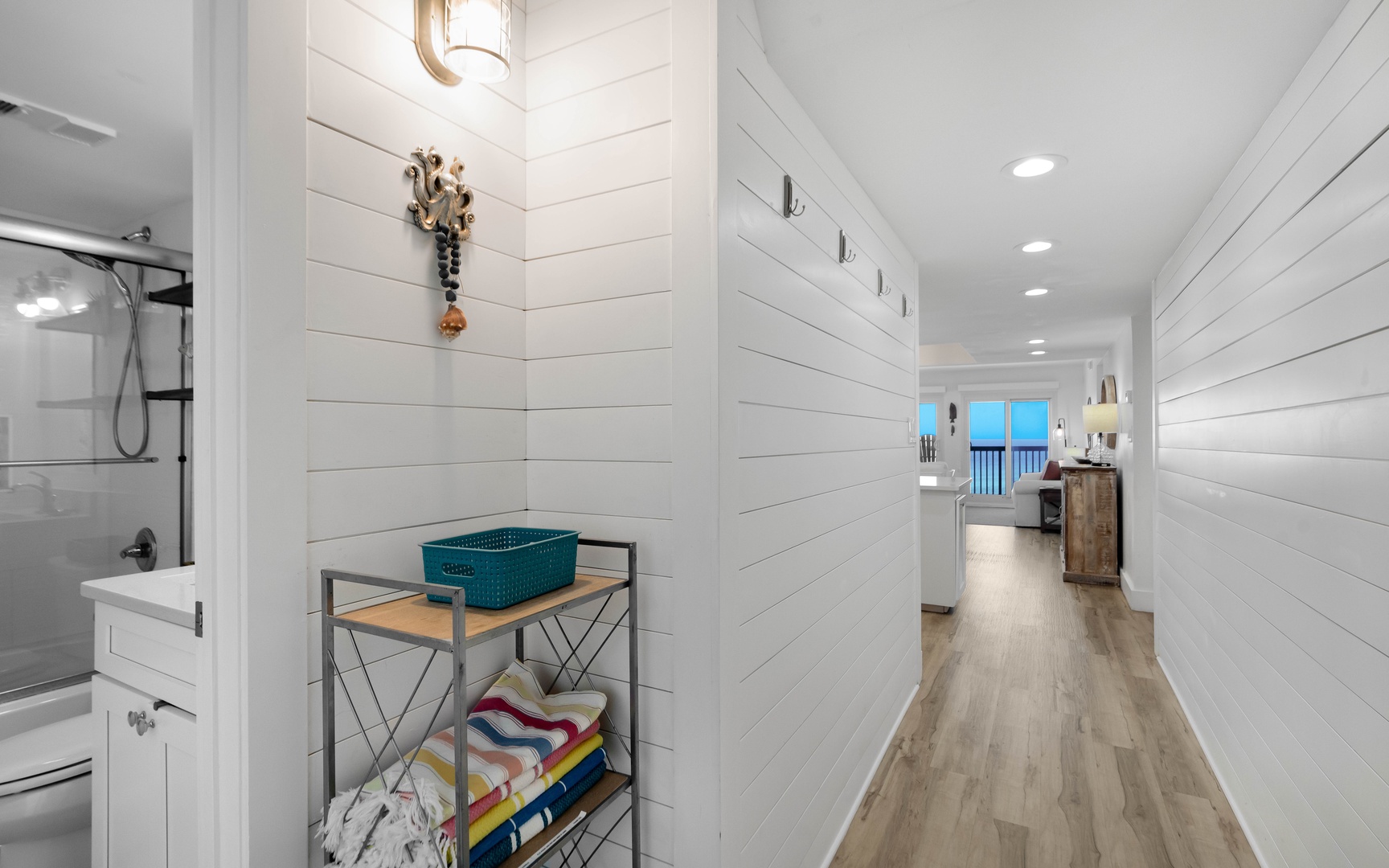 Unwind in your private bathroom with modern fixtures and thoughtful storage for all your beach essentials.