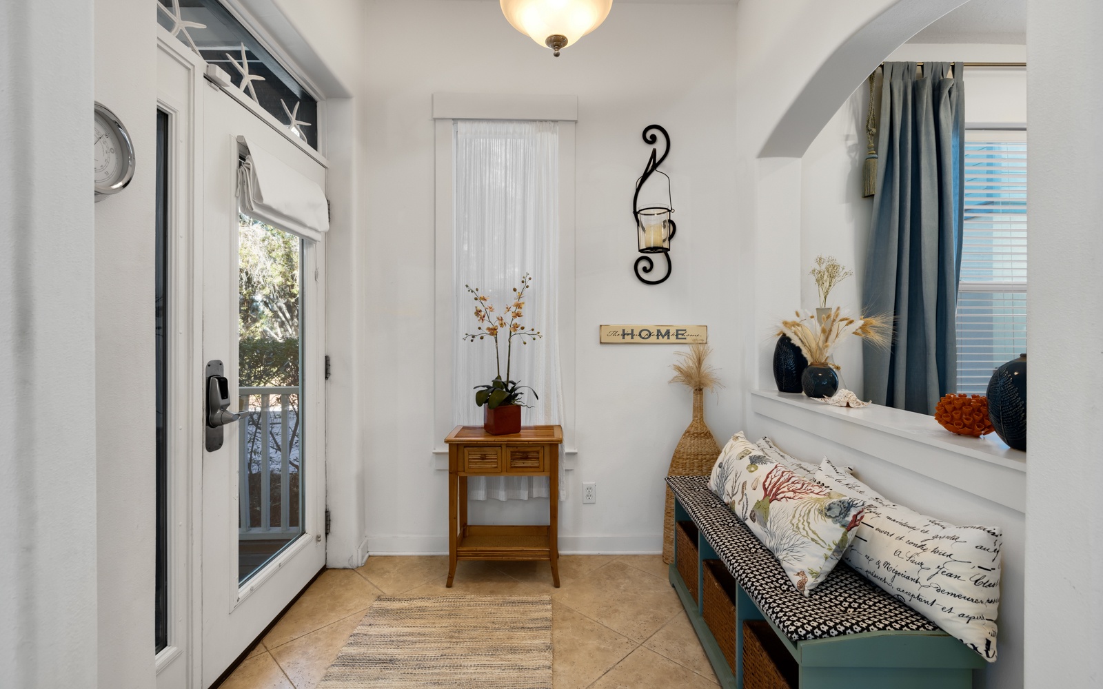 Your charming entryway welcomes you with warm lighting, cozy seating, and thoughtful touches that make arrival feel like coming home.