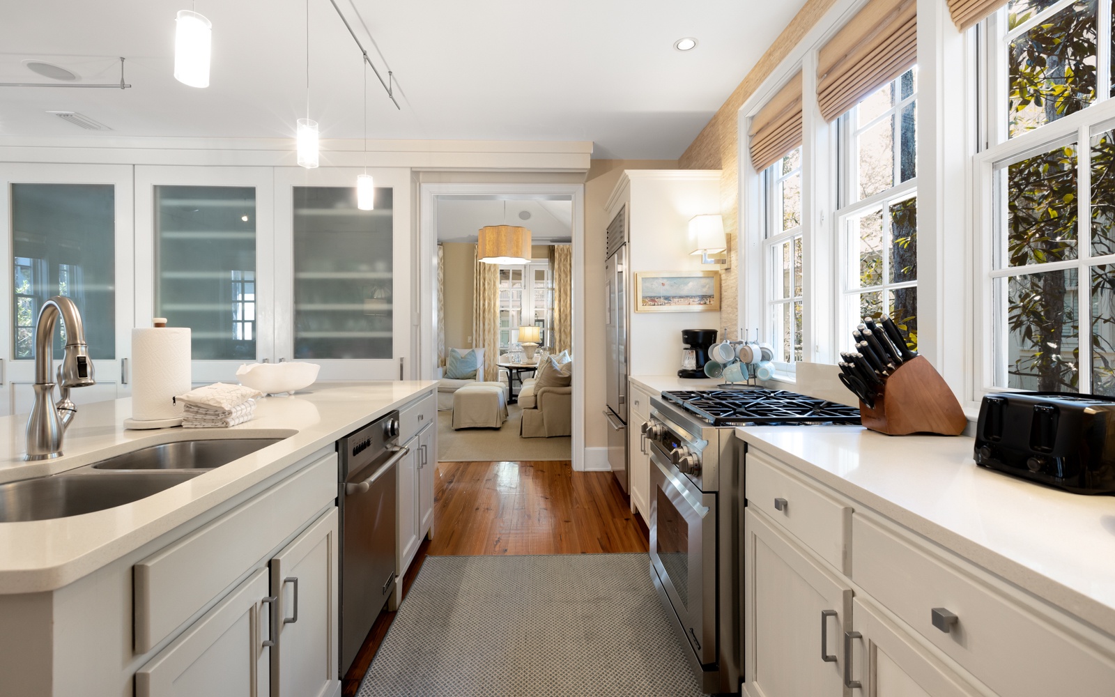 You'll love cooking in this bright, elegant kitchen with premium appliances, gleaming countertops, and abundant natural light streaming through large windows.