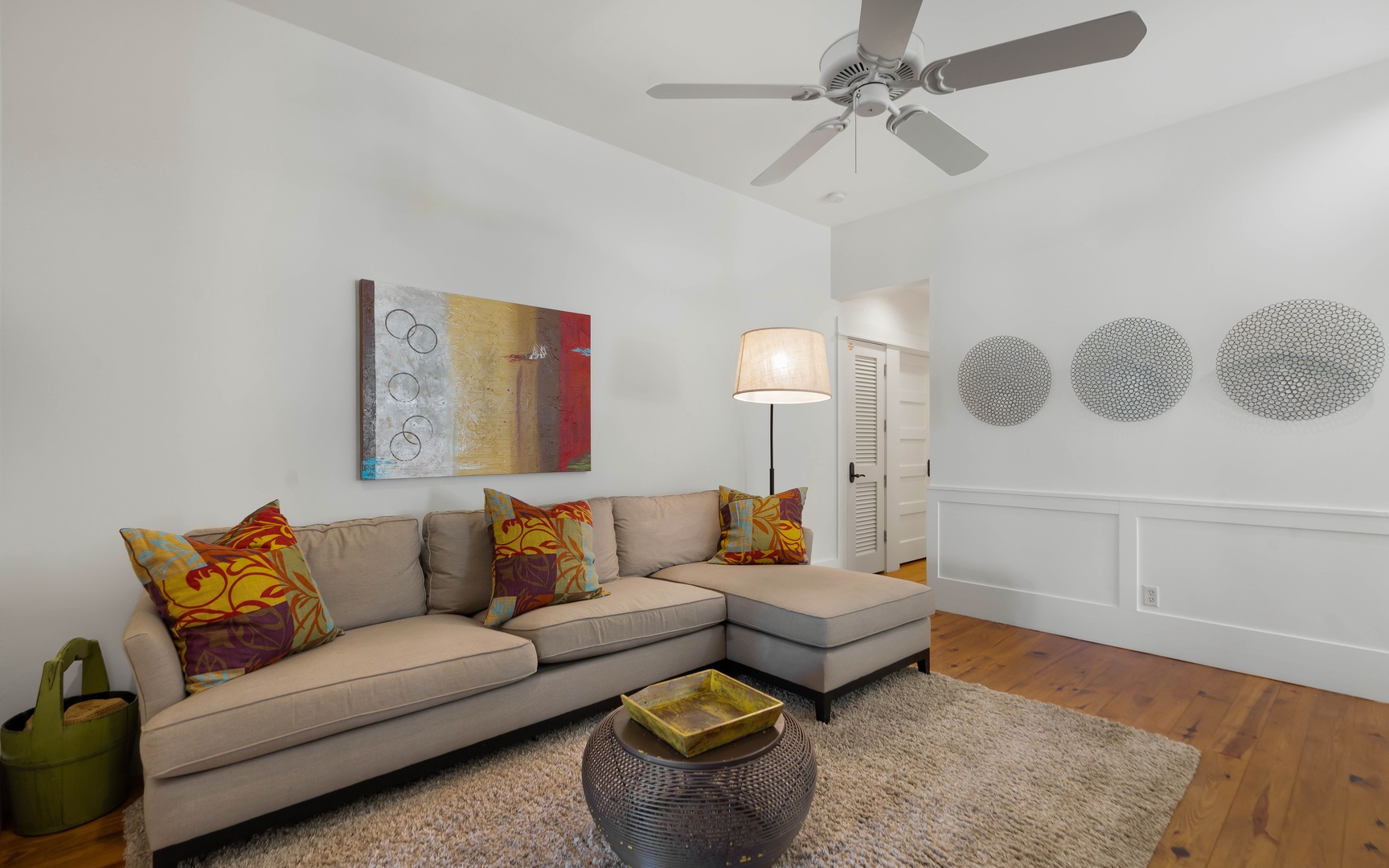 Relax in your stylish living room with cozy sectional seating, vibrant artwork, and thoughtful touches that make it feel like home.