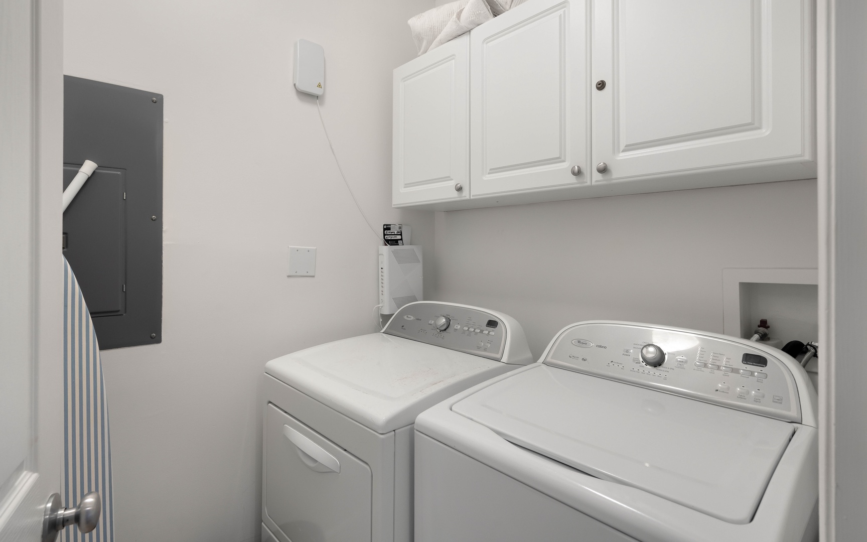 Your private laundry room keeps your vacation wardrobe fresh with modern washer and dryer, plus convenient storage.