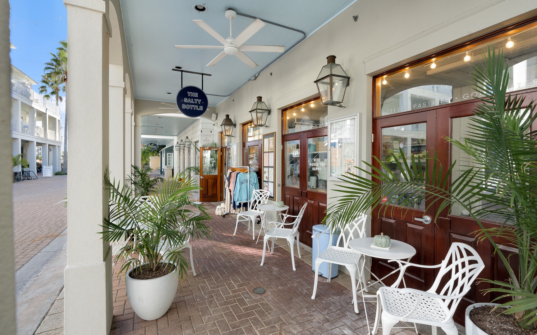 Charming covered walkway with shops and cafés creates a delightful stroll through this coastal shopping district.