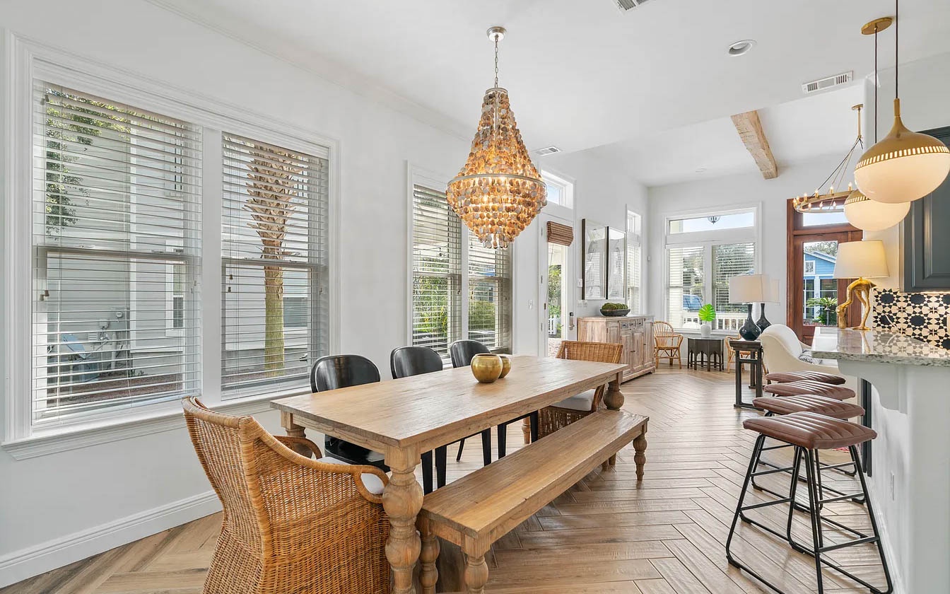 Gather around this gorgeous dining table where your group can share meals under sparkling chandelier light, with kitchen bar seating perfect for morning coffee.