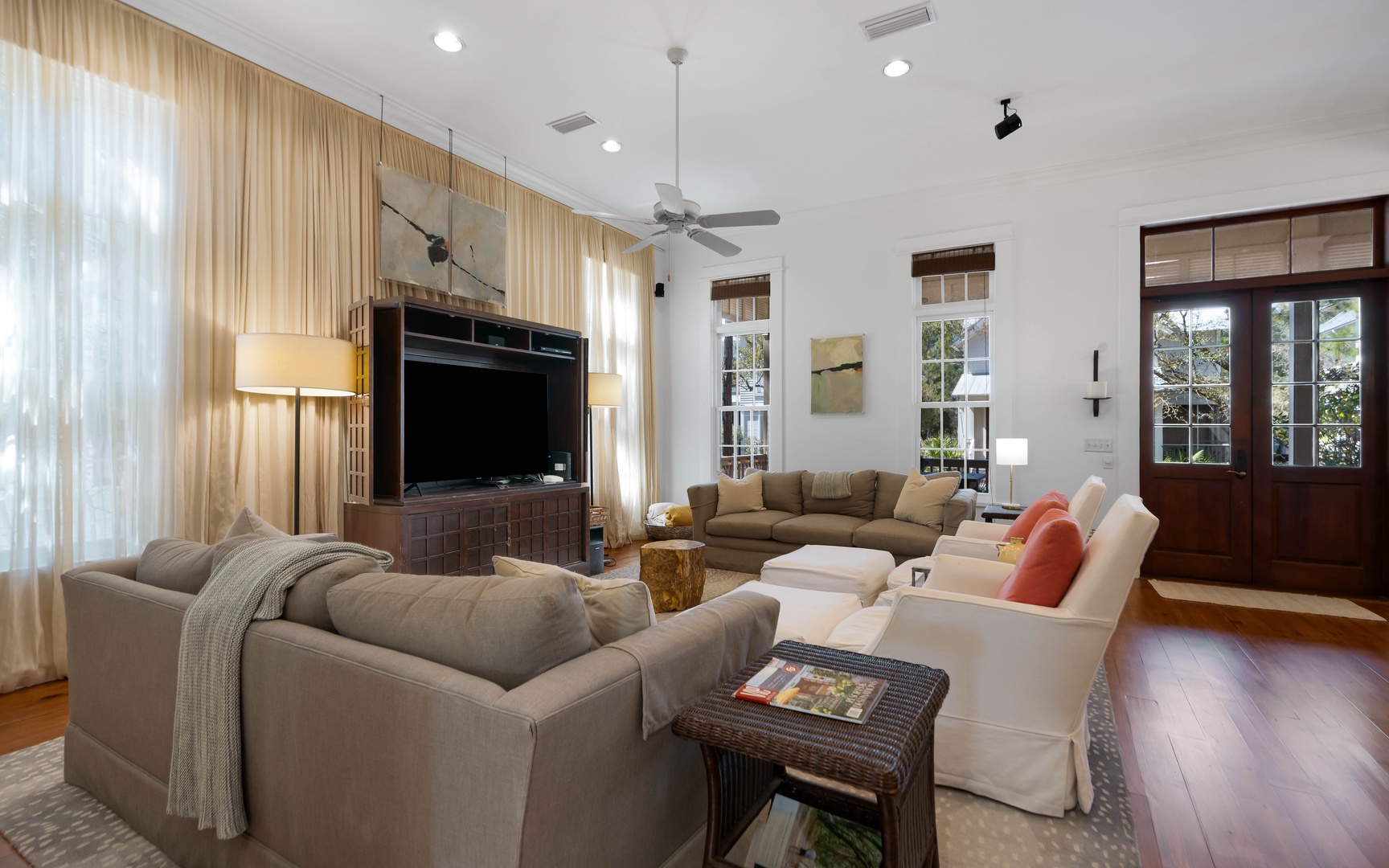 Relax in your spacious living room where plush sofas and warm lighting create the perfect gathering space for memorable evenings together.